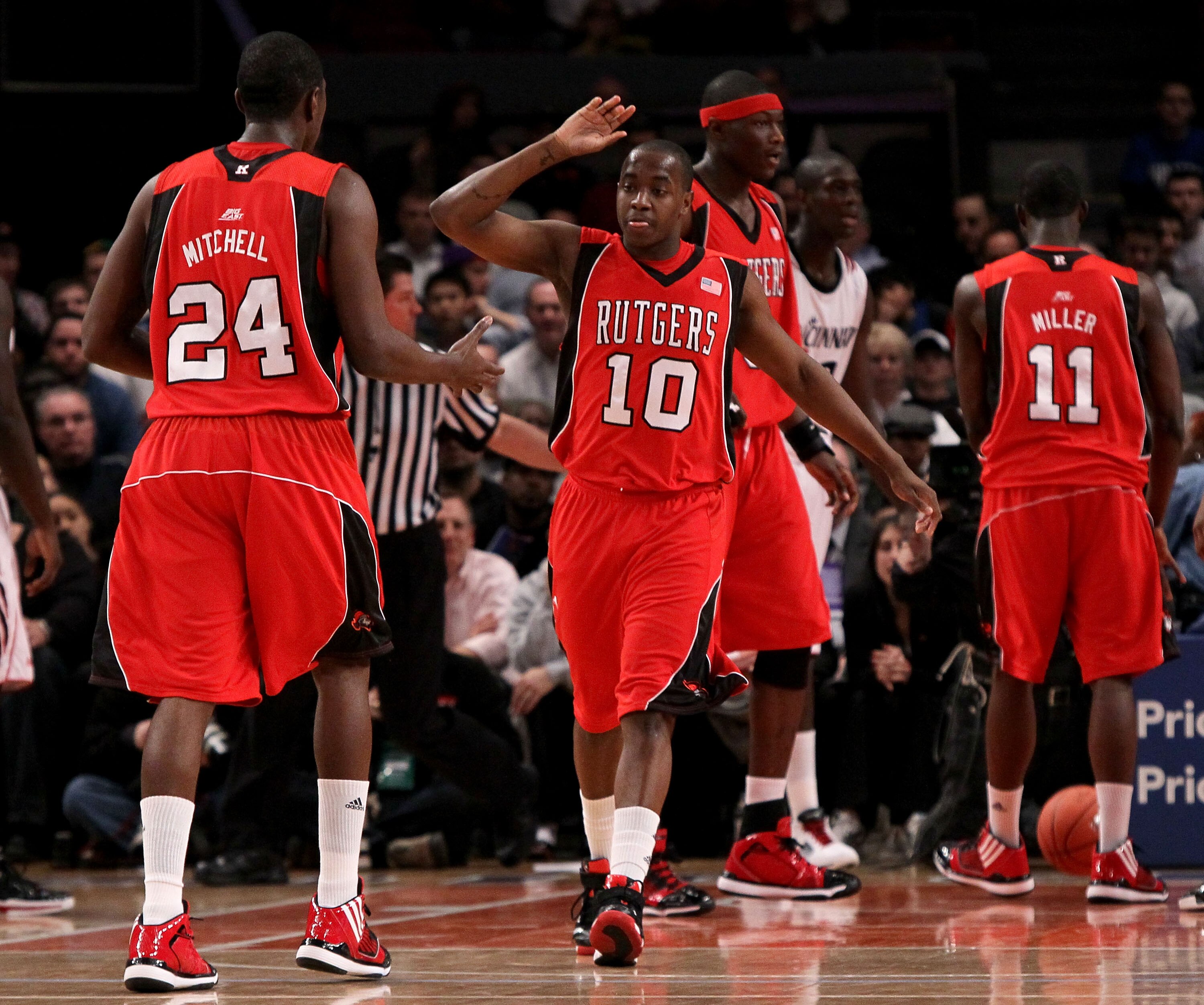 NEW YORK - MARCH 09: James Beatty #10 and Jonathan Mitchell #24 of the Rutgers Scarlet Knights react after a play against the Cincinnati Bearcats during the first round game of the Big East Basketball Tournament at Madison Square Garden on March 9, 2010 i