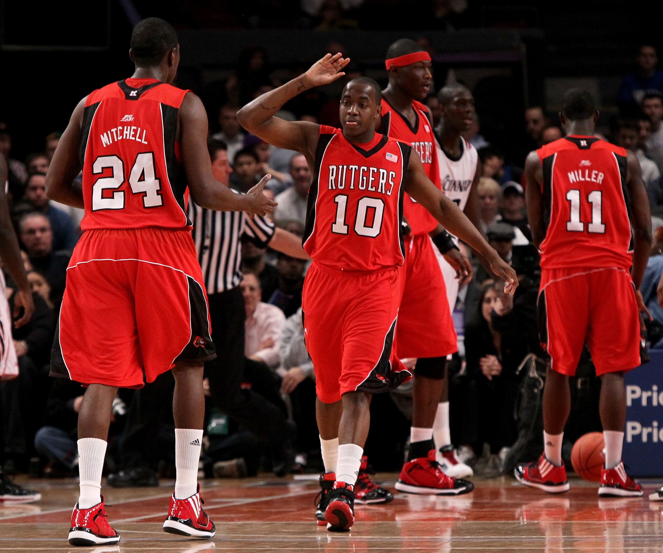 NEW YORK - MARCH 09: James Beatty #10 and Jonathan Mitchell #24 of the Rutgers Scarlet Knights react after a play against the Cincinnati Bearcats during the first round game of the Big East Basketball Tournament at Madison Square Garden on March 9, 2010 i