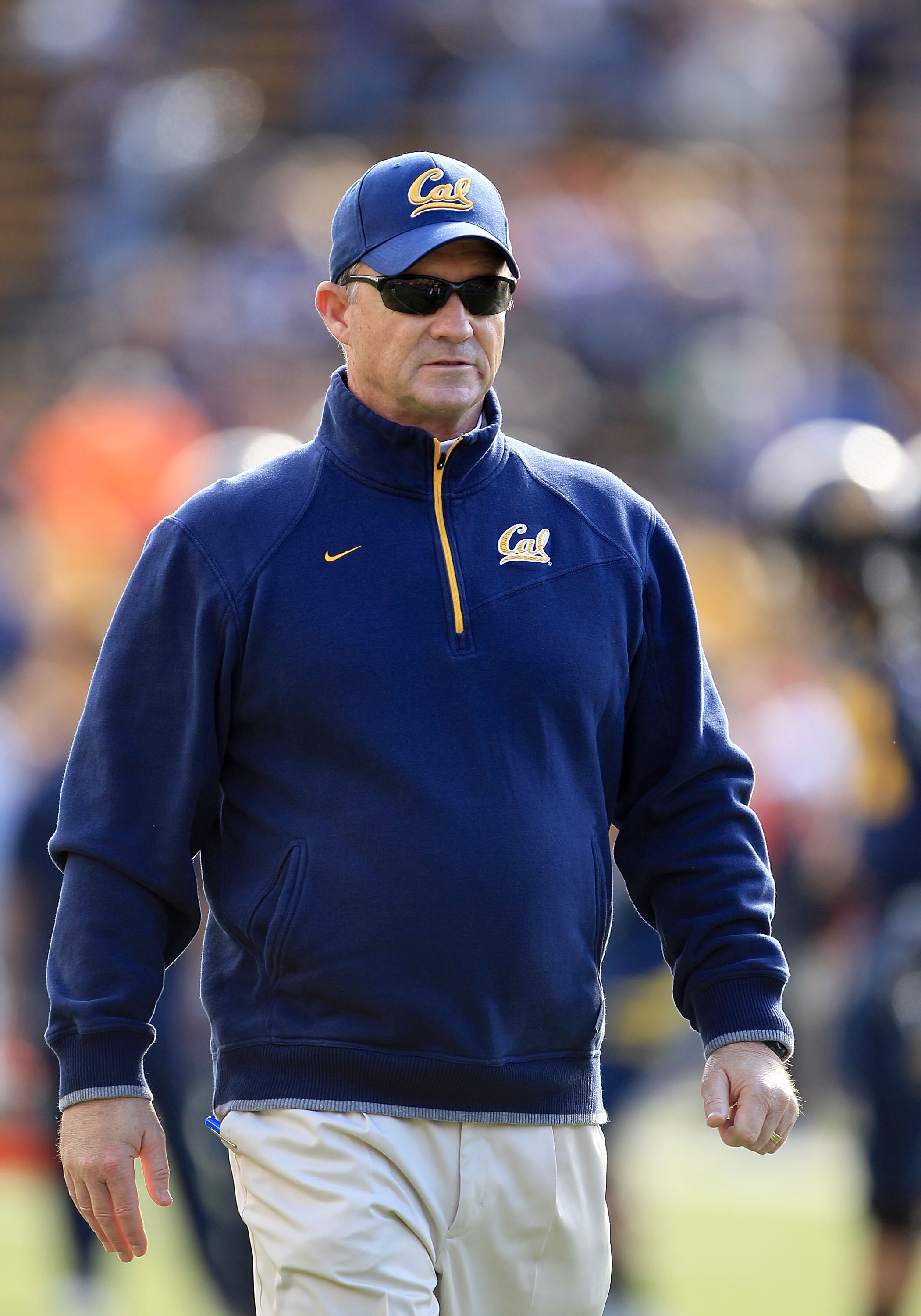 BERKELEY, CA - NOVEMBER 20: Head coach Jeff Tedford of the California Golden Bears watches his team warm up before their game against the Stanford Cardinal at California Memorial Stadium on November 20, 2010 in Berkeley, California. (Photo by Ezra Shaw/ BERKELEY, CA - NOVEMBER 20: Head coach Jeff Tedford of the California Golden Bears watches his team warm up before their game against the Stanford Cardinal at California Memorial Stadium on November 20, 2010 in Berkeley, California. (Photo by Ezra Shaw/