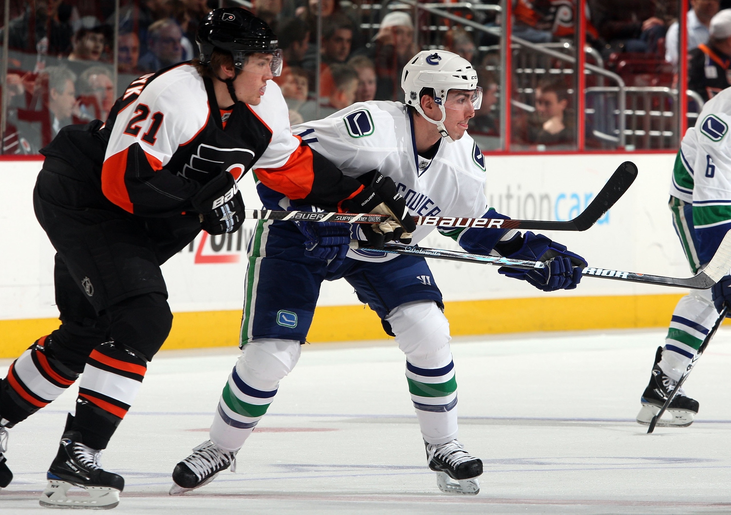 PHILADELPHIA - DECEMBER 03:  Alexandre Burrows #14 of the Vancouver Canucks skates against James van Riemsdyk #21 of the Philadelphia Flyers on December 3, 2009 at Wachovia Center in Philadelphia, Pennsylvania. The Canucks defeated the Flyers 3-0.  (Photo