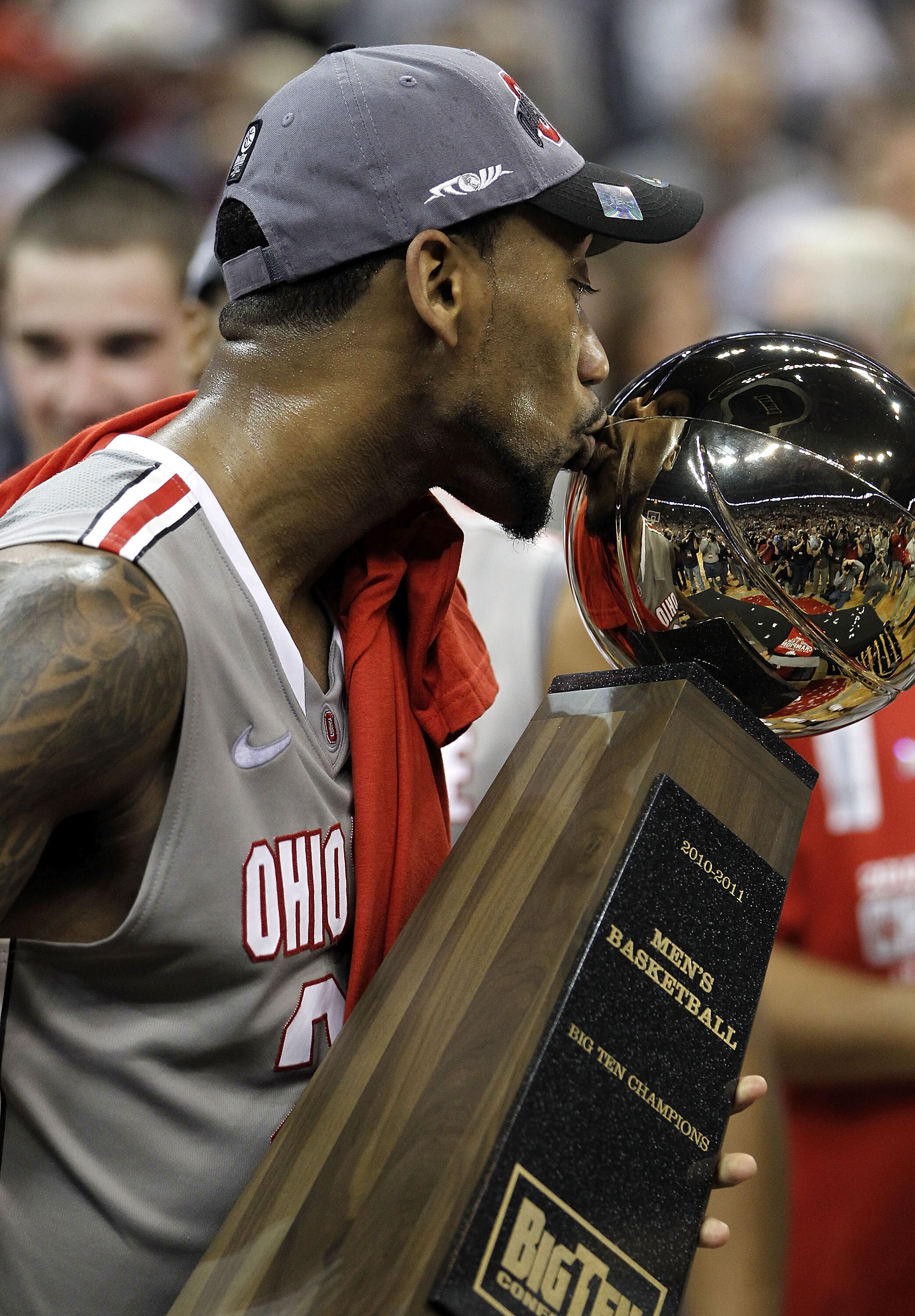COLUMBUS, OH - MARCH 06:  David Lighty #23 of the Ohio State Buckeyes kisses the Big Ten trophy after beating the Wisconsin Badgers 93-65 on March 6, 2011 at the Value City Arena in Columbus, Ohio.  (Photo by Gregory Shamus/Getty Images)