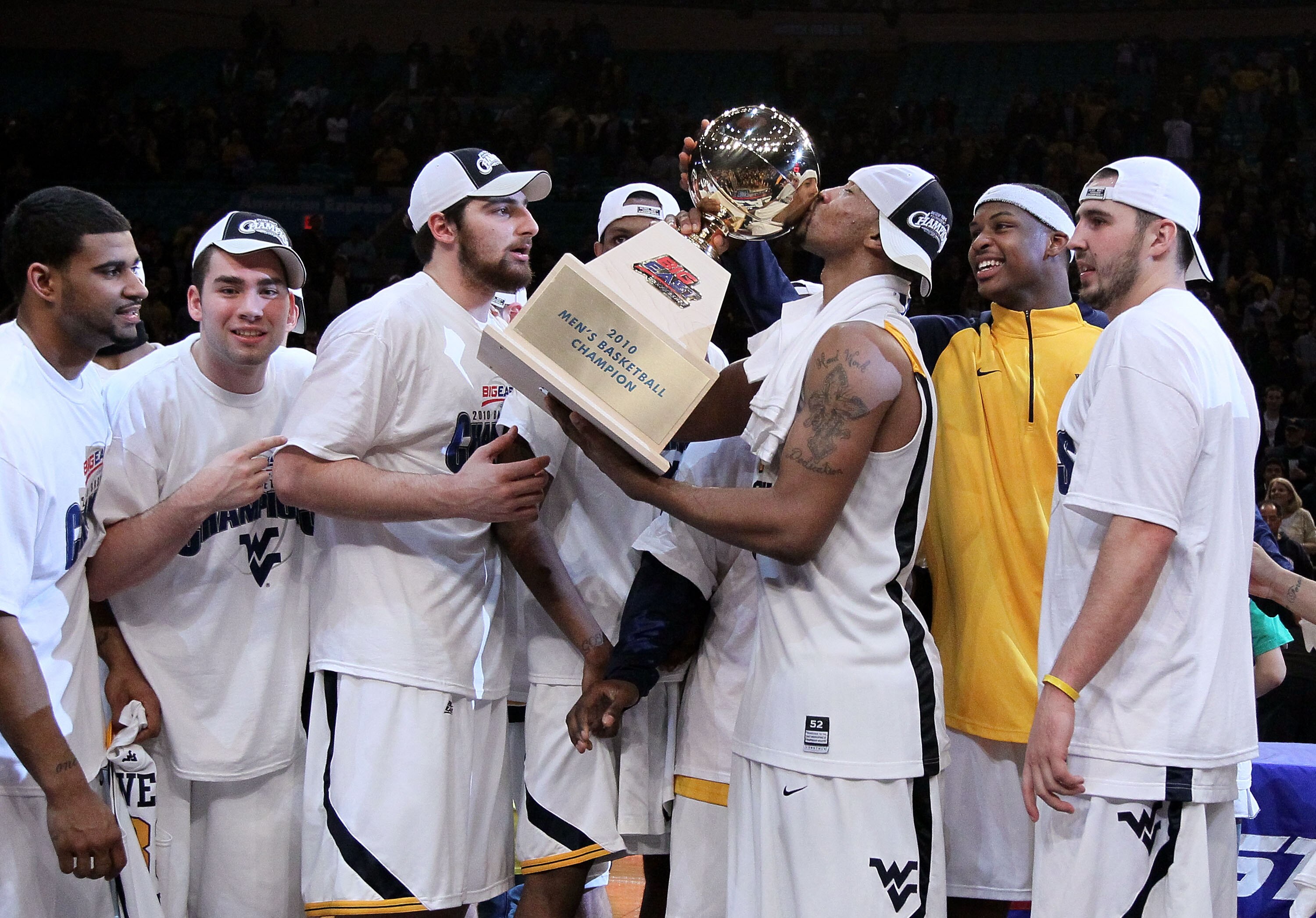 NEW YORK - MARCH 13: Da'Sean Butler #1 of the West Virginia Mountaineers kisses the championship trophy after defeating the Georgetown Hoyas during the championship of the 2010 NCAA Big East Tournament at Madison Square Garden on March 13, 2010 in New Yor