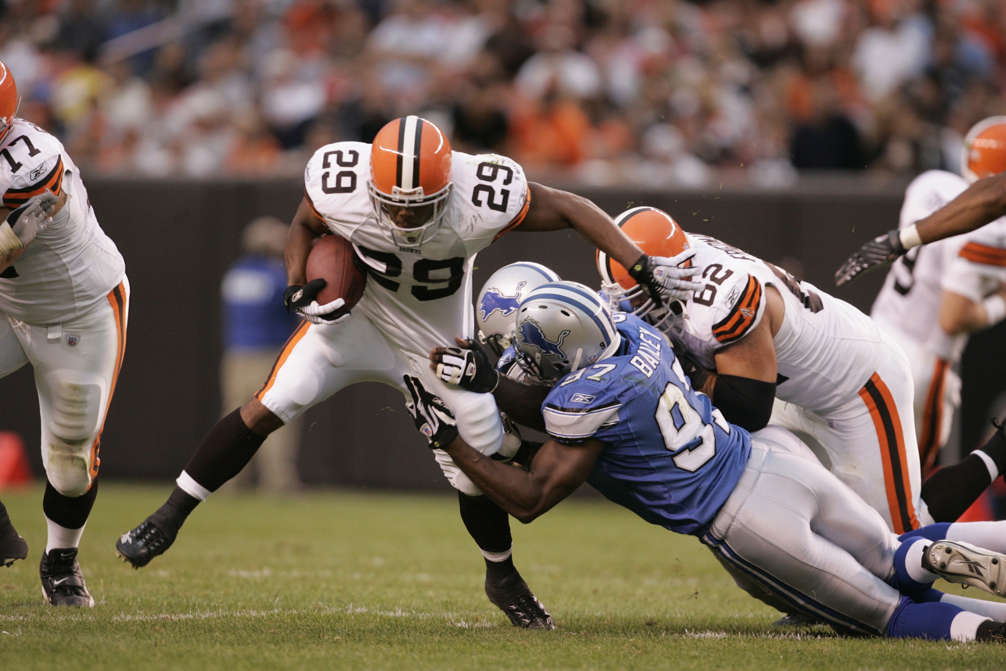 CLEVELAND - AUGUST 18:  Jason Wright #29 of the Cleveland Browns runs the ball as Boss Bailey #97 of the Detroit Lions attempts to tackle during the pre-season game at Cleveland Browns Stadium on August 18, 2007 in Cleveland, Ohio.  The Lions defeated the