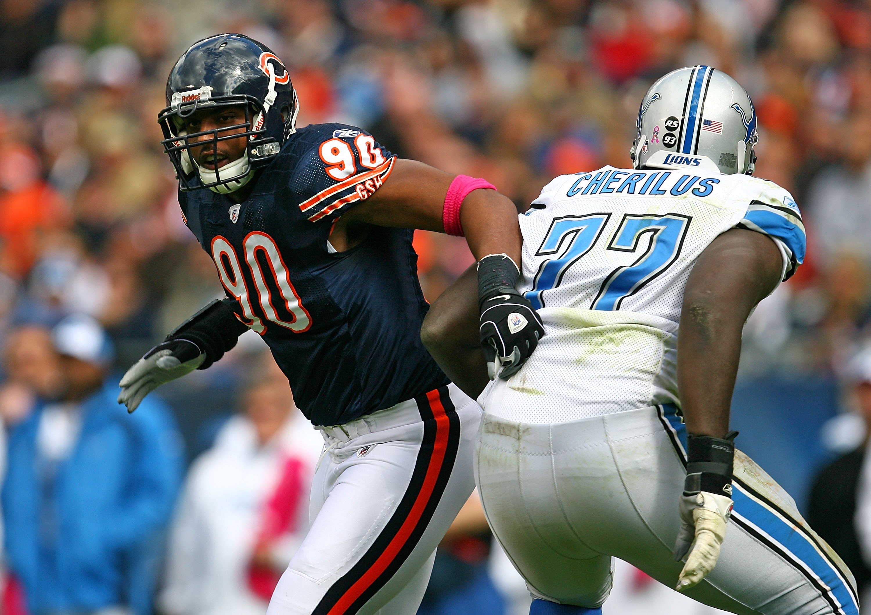 CHICAGO - OCTOBER 04: Jarron Gilbert #90 of the Chicago Bears moves past Gosder Cherilus #77 of the Detroit Lions on October 4, 2009 at Soldier Field in Chicago, Illinois. The Bears defeated the Lions 48-24. (Photo by Jonathan Daniel/Getty Images)