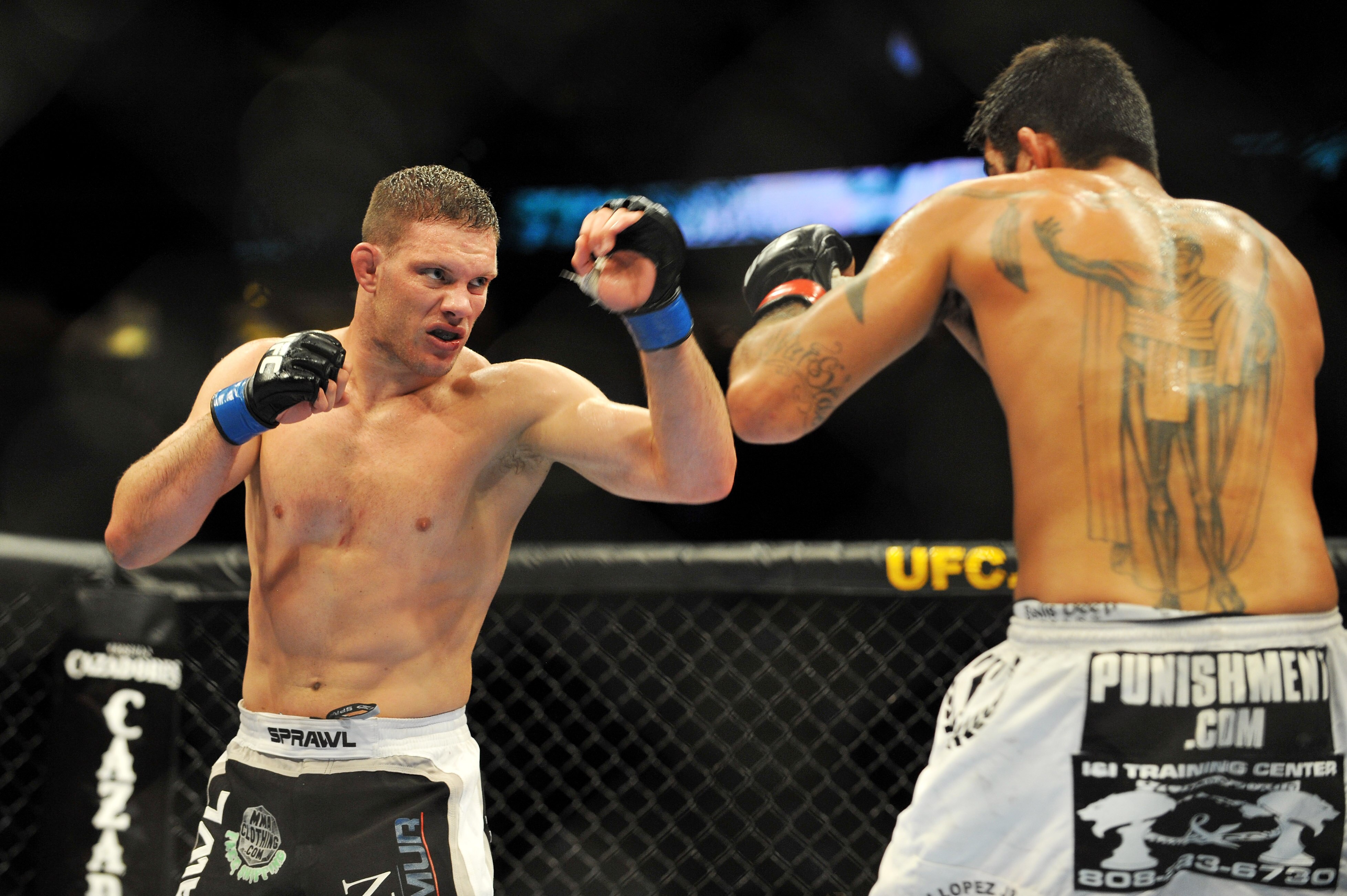 PHILADELPHIA - AUGUST 08:  (L-R)  Ricardo Almeida battles Kendall Grove during their middleweight bout at UFC 101: Declaration at the Wachovia Center on August 8, 2009 in Philadelphia, Pennsylvania.  Almeida defeated Grove by unanimous decision.  (Photo b
