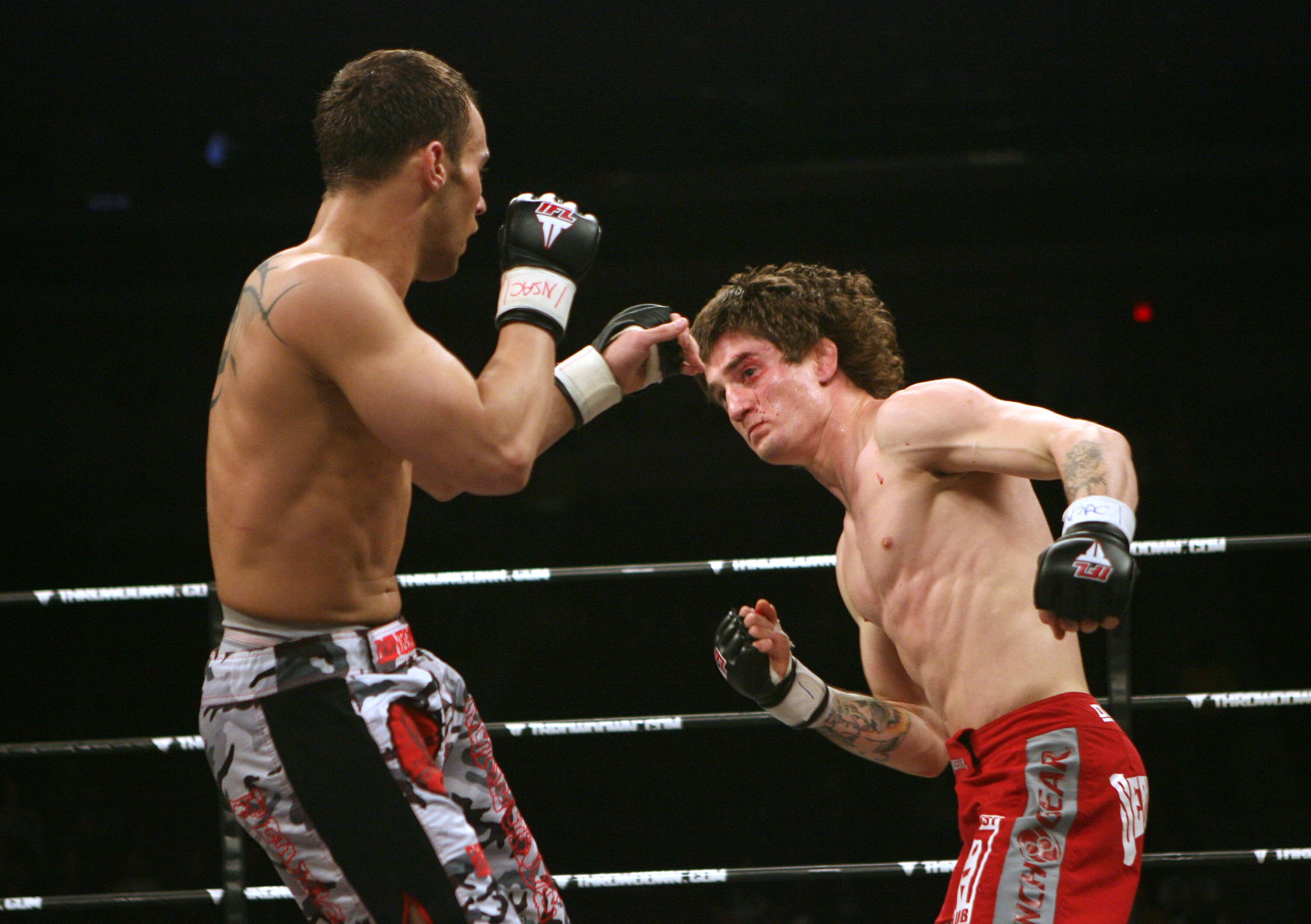 LAS VEGAS - FEBRUARY 29:  Ian Loveland red trunks of Team Quest fights against Dennis Davis camo trunks of Team Tompkins during their featherweight bout at The Orleans Arena on February 29, 2008 in Las Vegas, Nevada.  (Photo by Ethan Miller/Getty Images)