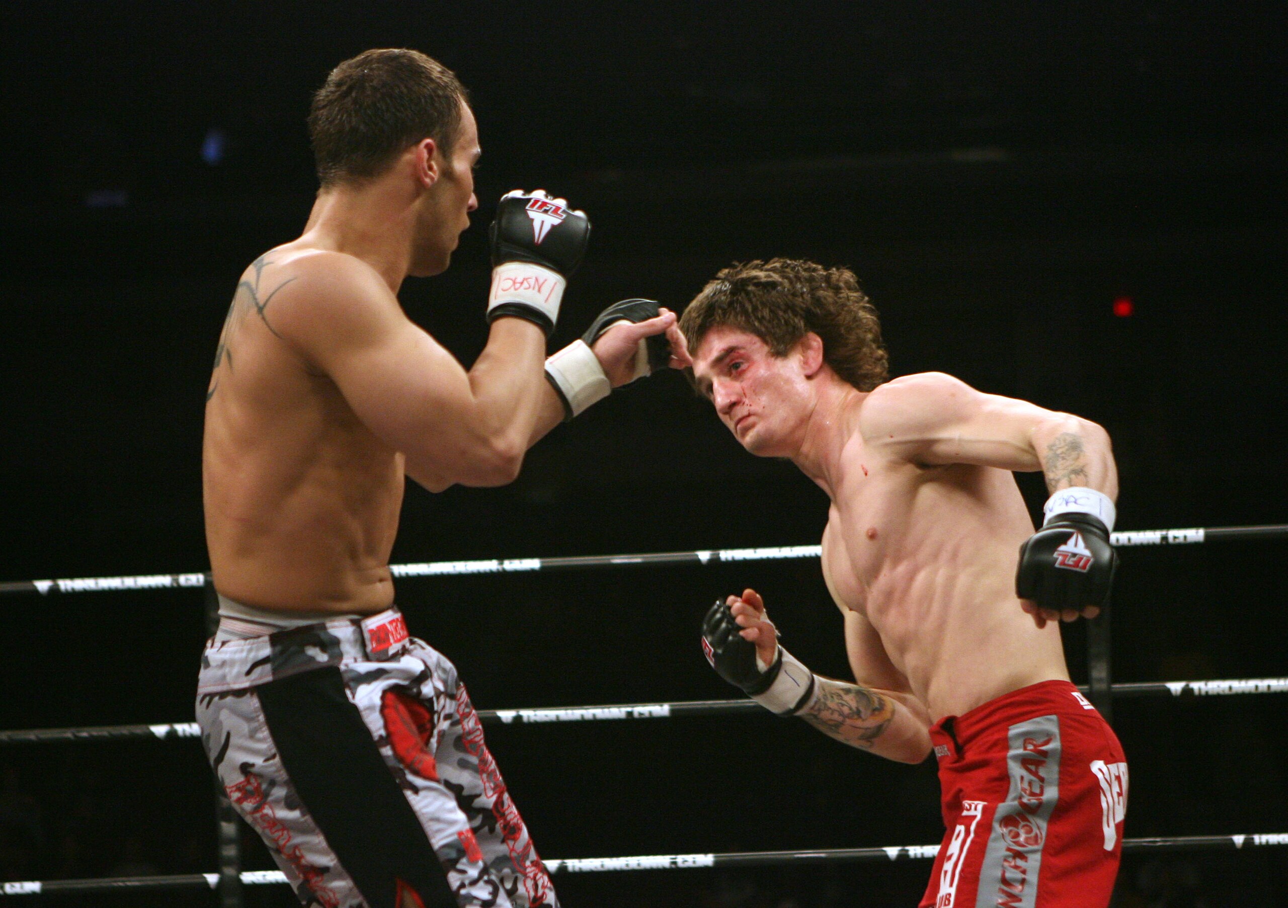 LAS VEGAS - FEBRUARY 29:  Ian Loveland red trunks of Team Quest fights against Dennis Davis camo trunks of Team Tompkins during their featherweight bout at The Orleans Arena on February 29, 2008 in Las Vegas, Nevada.  (Photo by Ethan Miller/Getty Images)