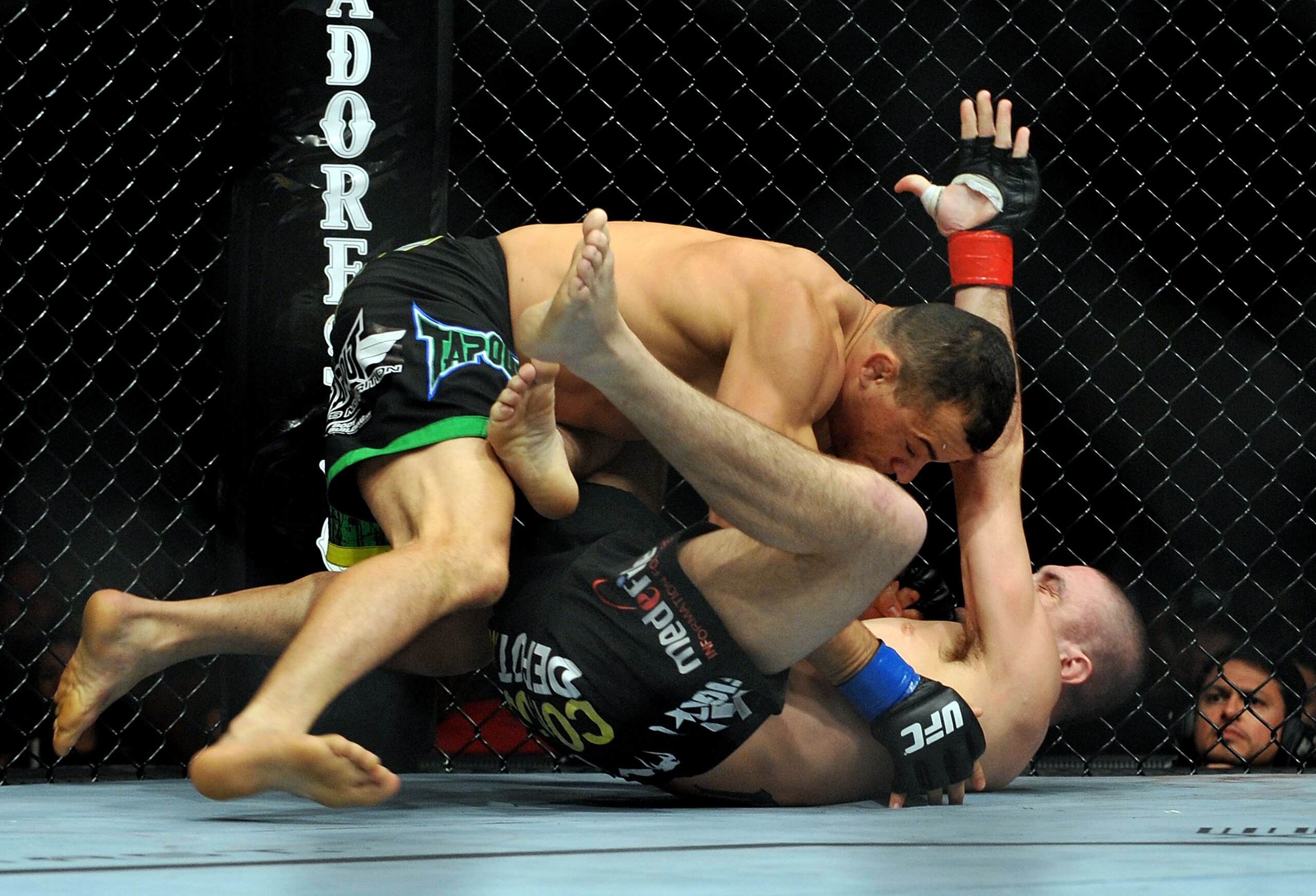 LOS ANGELES, CA - OCTOBER 24:  UFC fighter Gleison Tibau (top) battles with UFC fighter Josh Neer (top) during their Lightweight 'Swing' bout at UFC 104: Machida vs. Shogun at Staples Center on October 24, 2009 in Los Angeles, California.  (Photo by Jon K