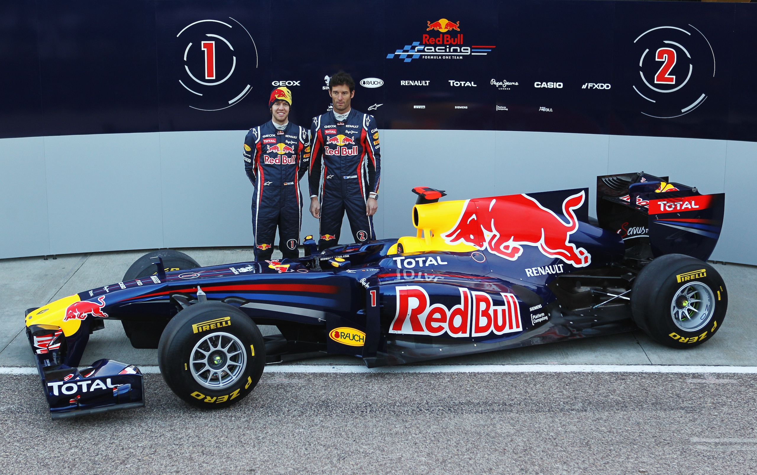VALENCIA, SPAIN - FEBRUARY 01:  Sebastian Vettel (L) of Germany and Mark Webber (R) of Australia attend the unveiling of the new Red Bull Racing RB7 at the Ricardo Tormo Circuit on February 1, 2011 in Valencia, Spain.  (Photo by Paul Gilham/Getty Images)