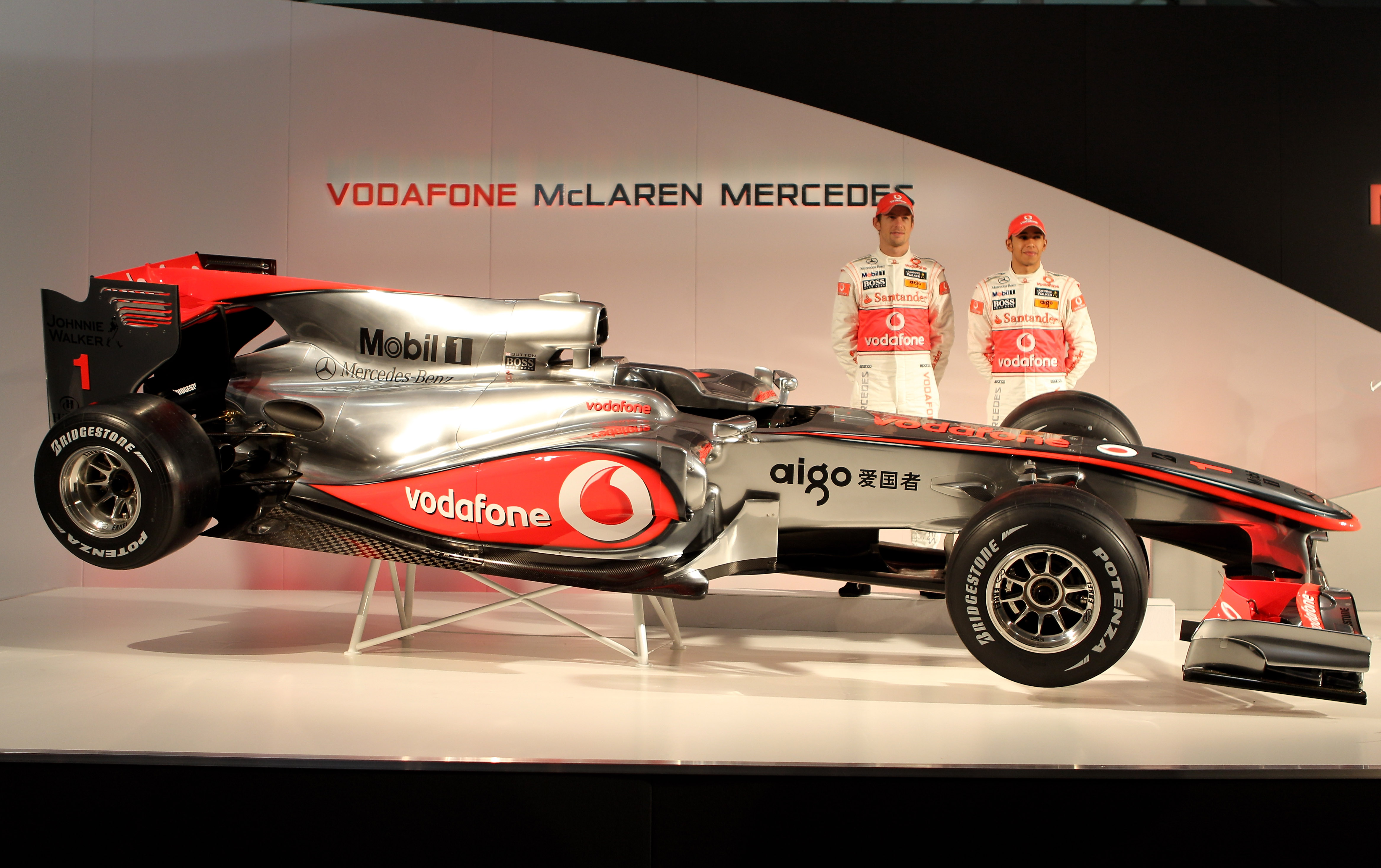 NEWBURY, ENGLAND - JANUARY 29:  Jenson Button and Lewis Hamilton of Great Britain and team Vodafone McLaren Mercedes at the unveiling of the new car for the 2010 Formula 1 season at the headquaters of Vodafone on January 29, 2010 in Newbury, England.  (Ph