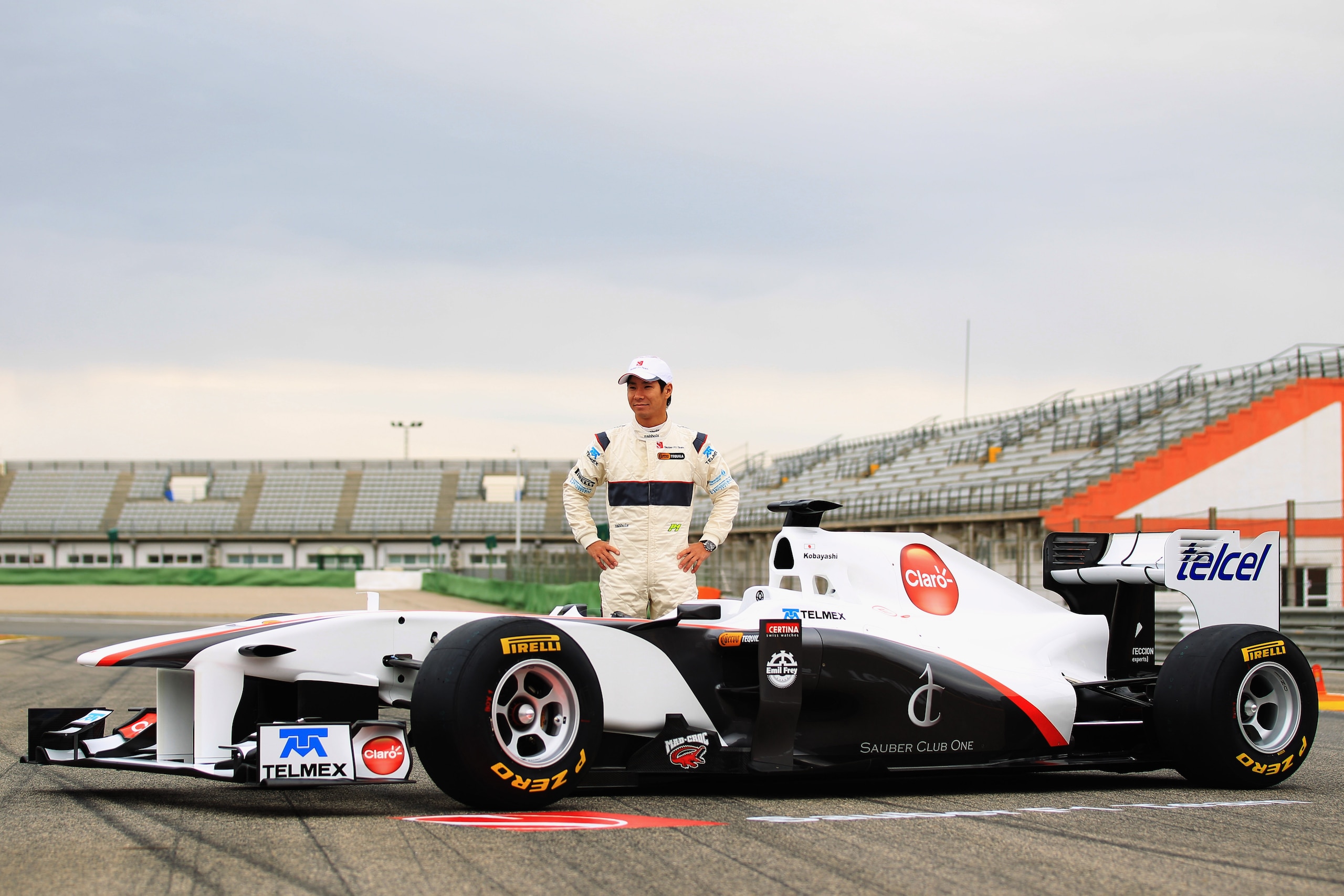 VALENCIA, SPAIN - JANUARY 31:  Kamui Kobayashi of Japan and Sauber F1 attends the unveiling of the new Sauber C30-Ferrari at the Ricardo Tormo Circuit on January 31, 2011 in Valencia, Spain.  (Photo by Mark Thompson/Getty Images)