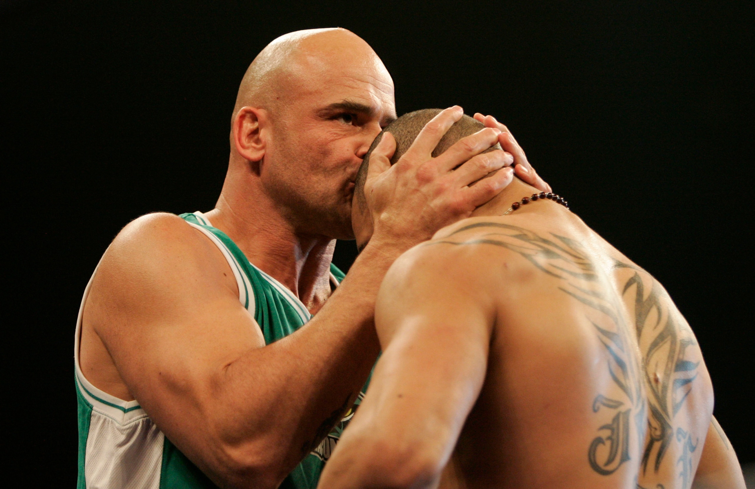 HOUSTON, TX - FEBRUARY 02:  Jay Hieron, welterweight fighter for the Anacondas, is congratulated by coach Bas Rutten during his fight against Victor Moreno of the Silverbacks at the International Fight League event at the Reliant Arena on February 2, 2007