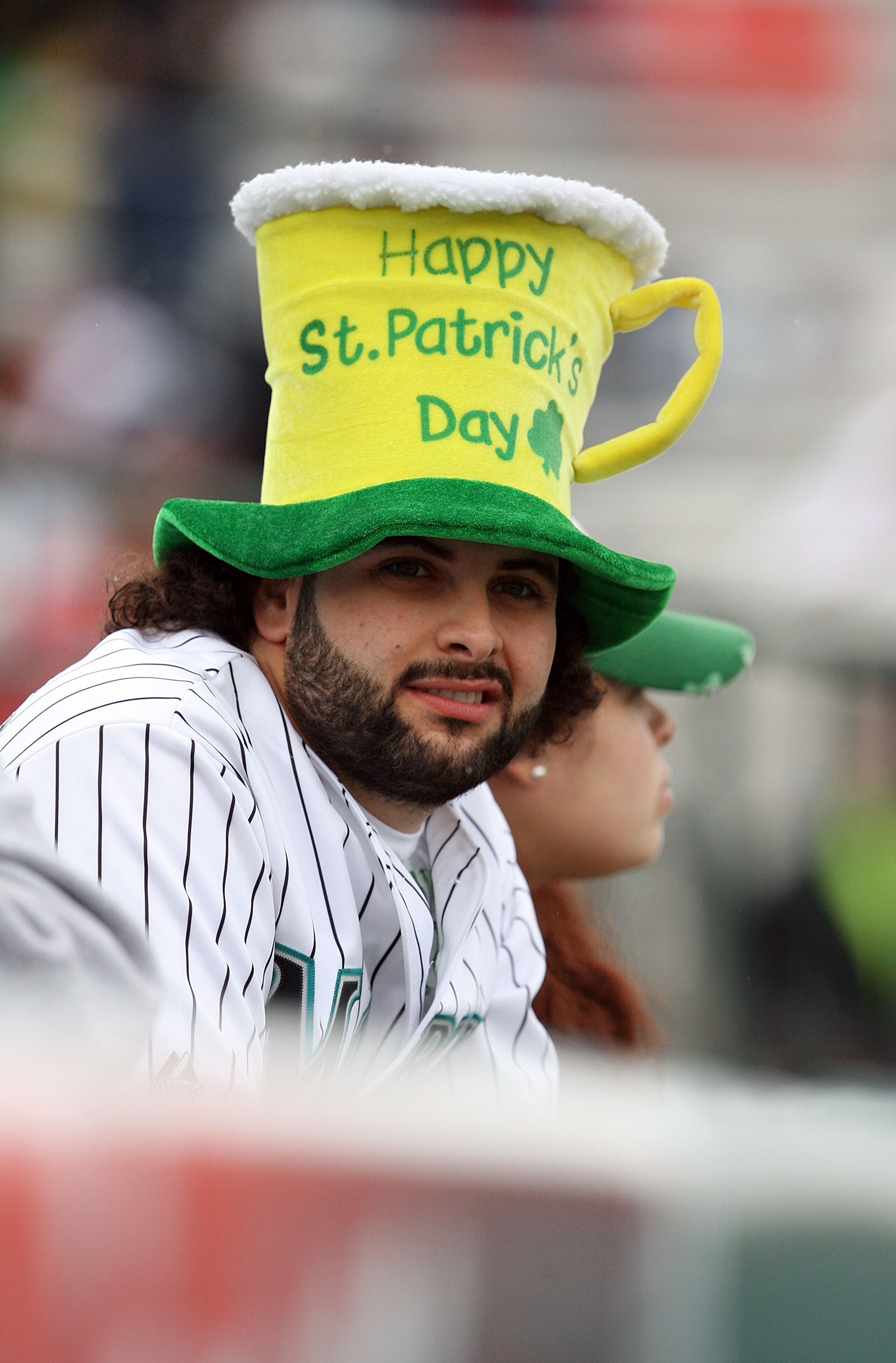 JUPITER, FL - MARCH 17:  A Marlins fan watches the the Atlanta Braves take on the Florida Marlins on St. Patrick's Day at Roger Dean Stadium on March 17, 2010 in Jupiter, Florida.  (Photo by Doug Benc/Getty Images)