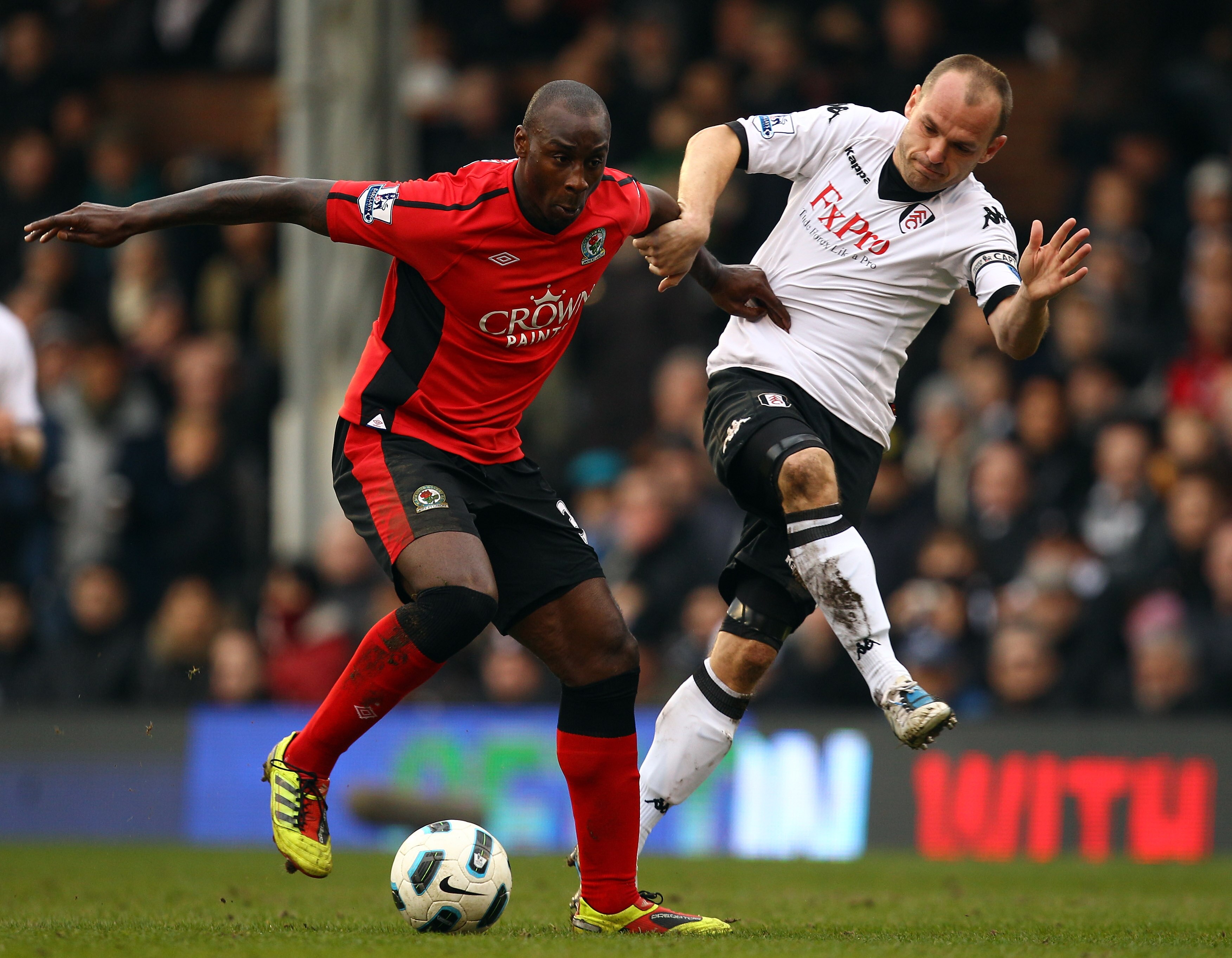 LONDON, ENGLAND - MARCH 05:  Jason Roberts of Blackburn holds off Danny Murphy of Fulham during the Barclays Premier League match between Fulham and Blackburn Rovers at Craven Cottage on March 5, 2011 in London, England.  (Photo by Richard Heathcote/Getty