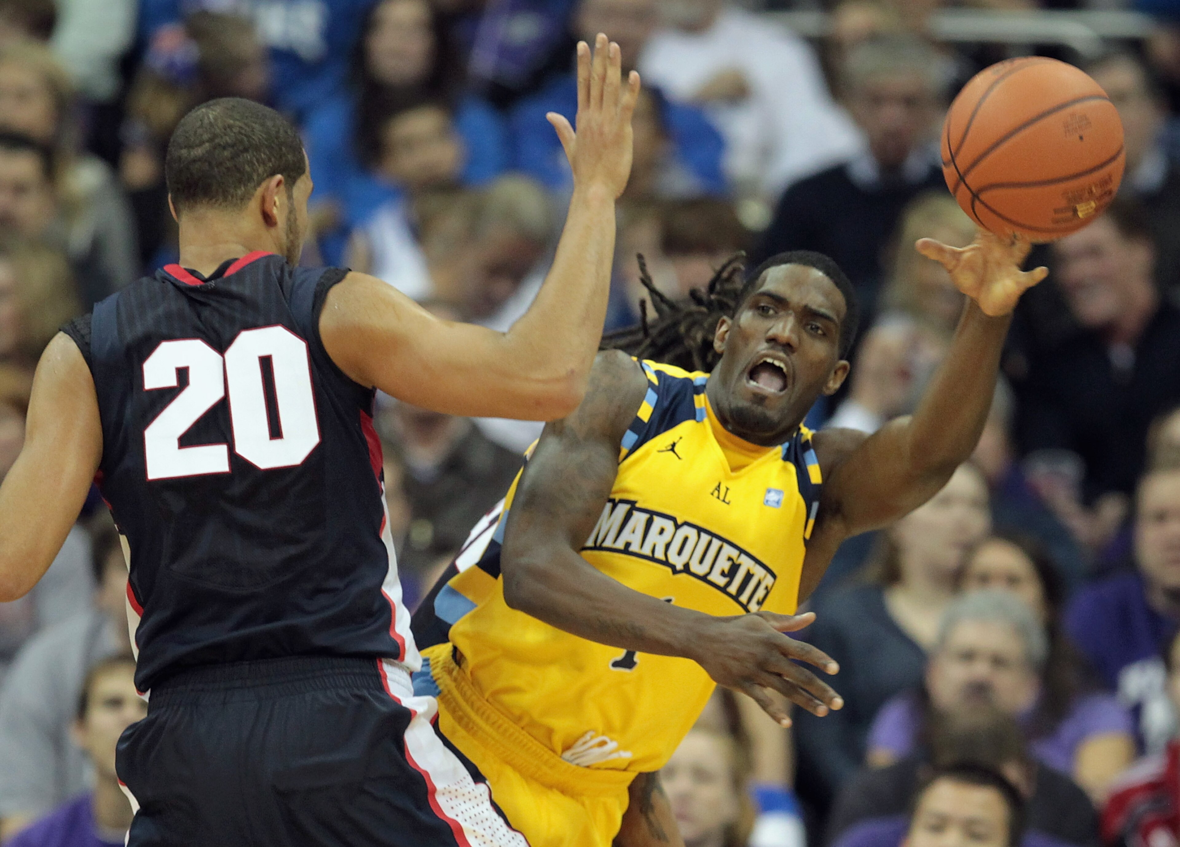 KANSAS CITY, MO - NOVEMBER 23: Darius Johnson-Odom #1 of the Marquette Golden Eagles passes around Elias Harris #20 of the Gonzaga Bulldogs during the CBE Classic consolation game on November 23, 2010 at the Sprint Center in Kansas City, Missouri. (Phot KANSAS CITY, MO - NOVEMBER 23: Darius Johnson-Odom #1 of the Marquette Golden Eagles passes around Elias Harris #20 of the Gonzaga Bulldogs during the CBE Classic consolation game on November 23, 2010 at the Sprint Center in Kansas City, Missouri. (Phot