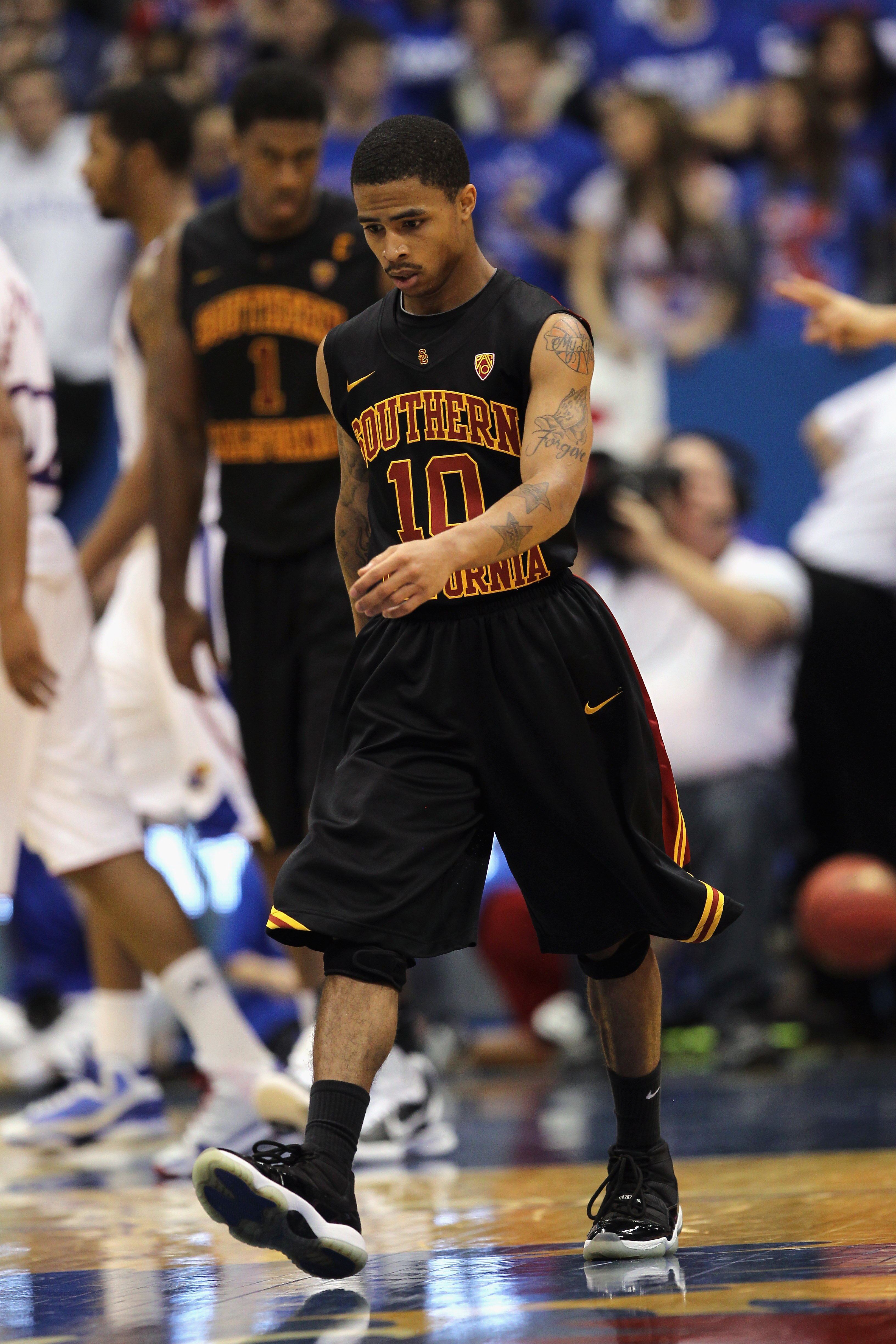 LAWRENCE, KS - DECEMBER 18:  Maurice Jones #10 of the USC Trojans walks off the court during a timeout in the game against the Kansas Jayhawks on December 18, 2010 at Allen Fieldhouse in Lawrence, Kansas.  (Photo by Jamie Squire/Getty Images)