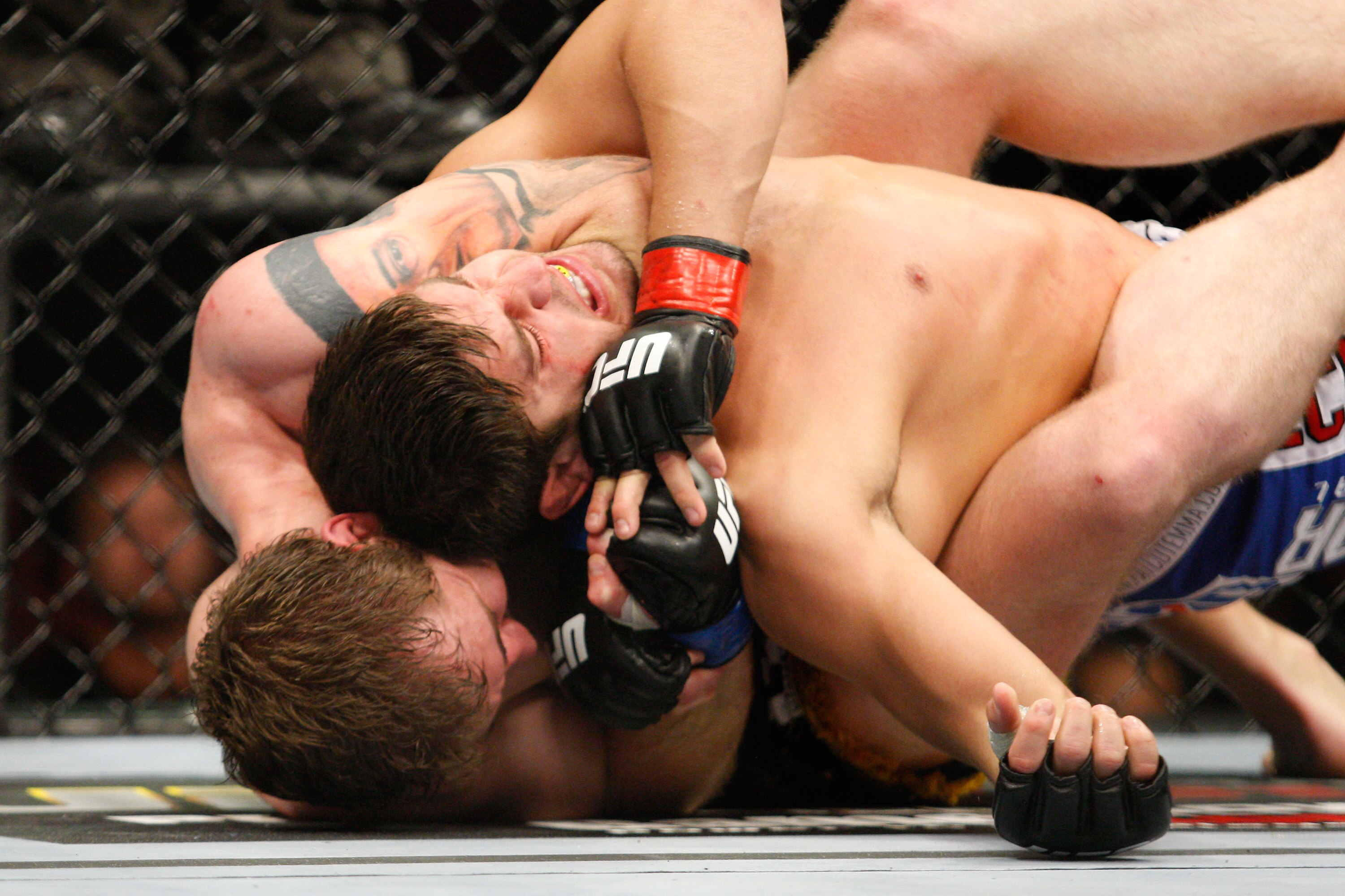 MONTREAL- MAY 8: Alan Belcher (bottom) holds on to Patrick Cote in their middleweight bout at UFC 113 at Bell Centre on May 8, 2010 in Montreal, Quebec, Canada. Alan Belcher won the bout by KO. (Photo by Richard Wolowicz/Getty Images)