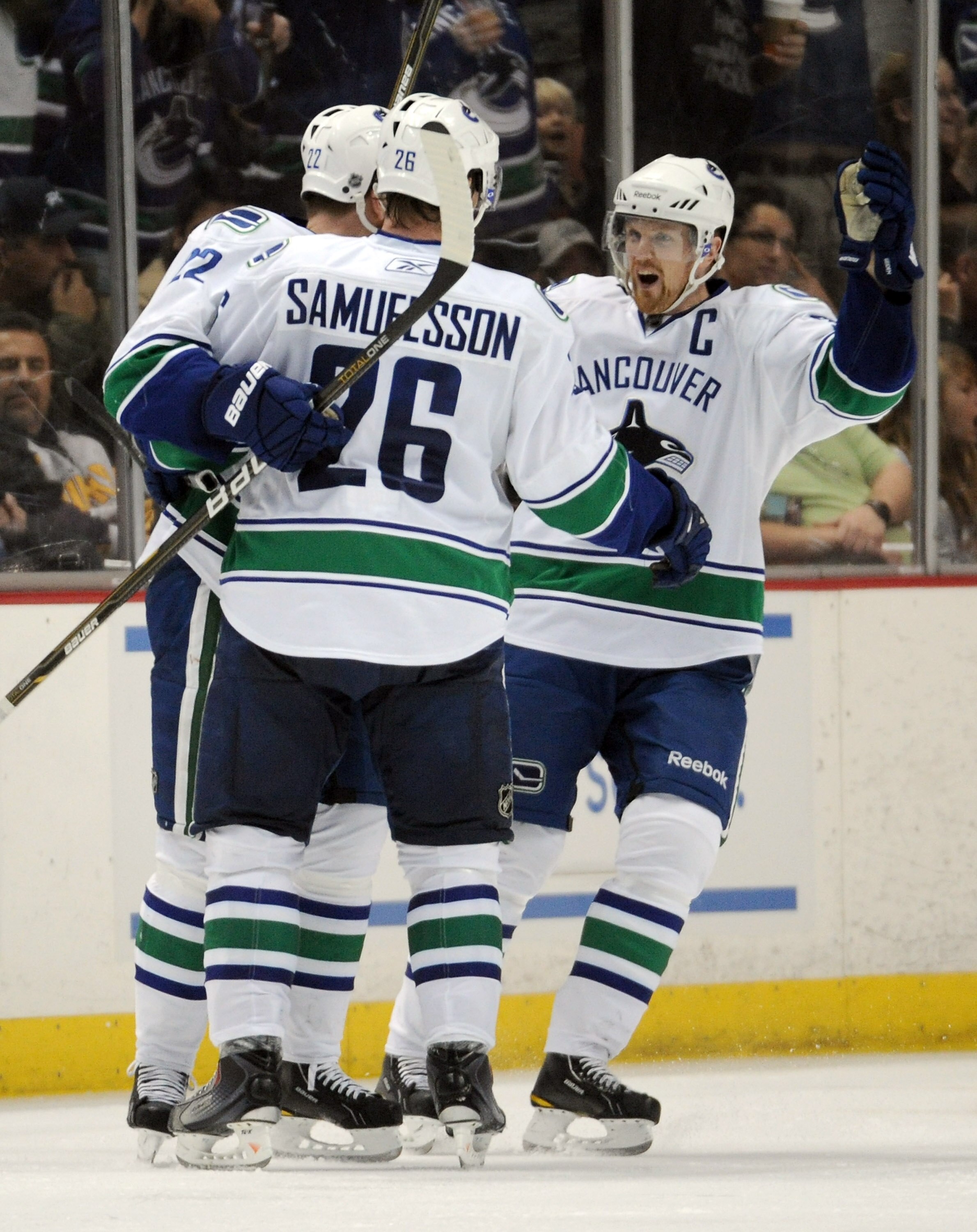 ANAHEIM, CA - MARCH 06: Henrik Sedin #33 of the Vancouver Canucks celebrates the goal of Daniel Sedin #22 with Mikael Samuelsson #26 for a 3-0 lead over the Anaheim Ducks at the Honda Center on March 6, 2011 in Anaheim, California. (Photo by Harry How/G ANAHEIM, CA - MARCH 06: Henrik Sedin #33 of the Vancouver Canucks celebrates the goal of Daniel Sedin #22 with Mikael Samuelsson #26 for a 3-0 lead over the Anaheim Ducks at the Honda Center on March 6, 2011 in Anaheim, California. (Photo by Harry How/G