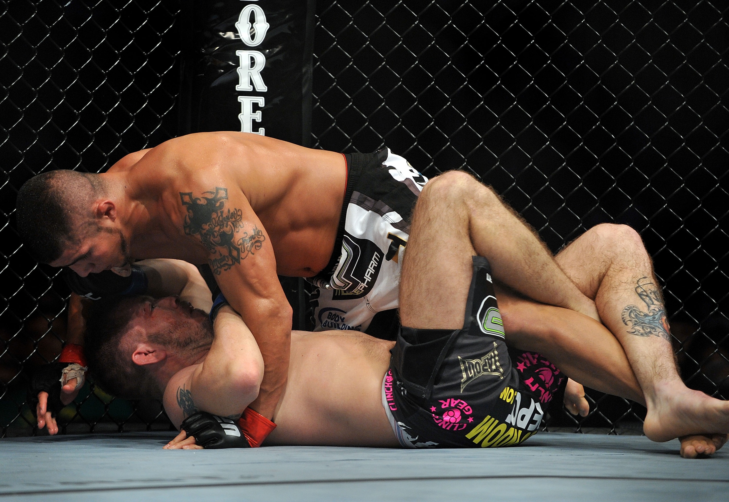 LOS ANGELES, CA - OCTOBER 24:  UFC fighter Joe Stevenson (top) battles with UFC fighter Spencer Fisher (bottom) during their Lightweight bout at UFC 104: Machida vs. Shogun at Staples Center on October 24, 2009 in Los Angeles, California.  (Photo by Jon K