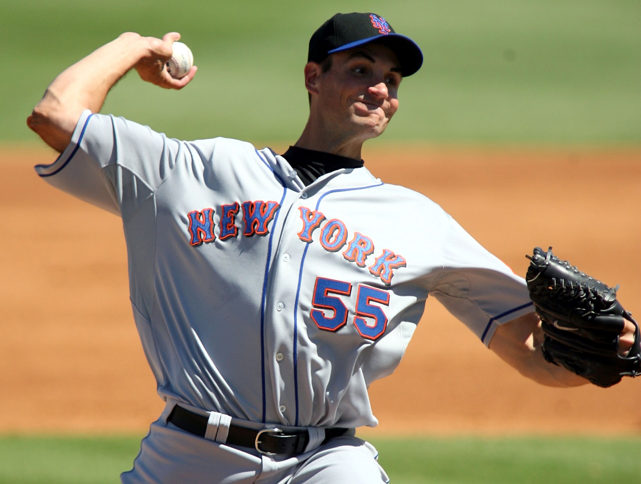 JUPITER, FL - MARCH 04:  Pitcher Chris Young #55 of the New York Mets throws against the Florida Marlins at Roger Dean Stadium on March 4, 2011 in Jupiter, Florida.  (Photo by Marc Serota/Getty Images)