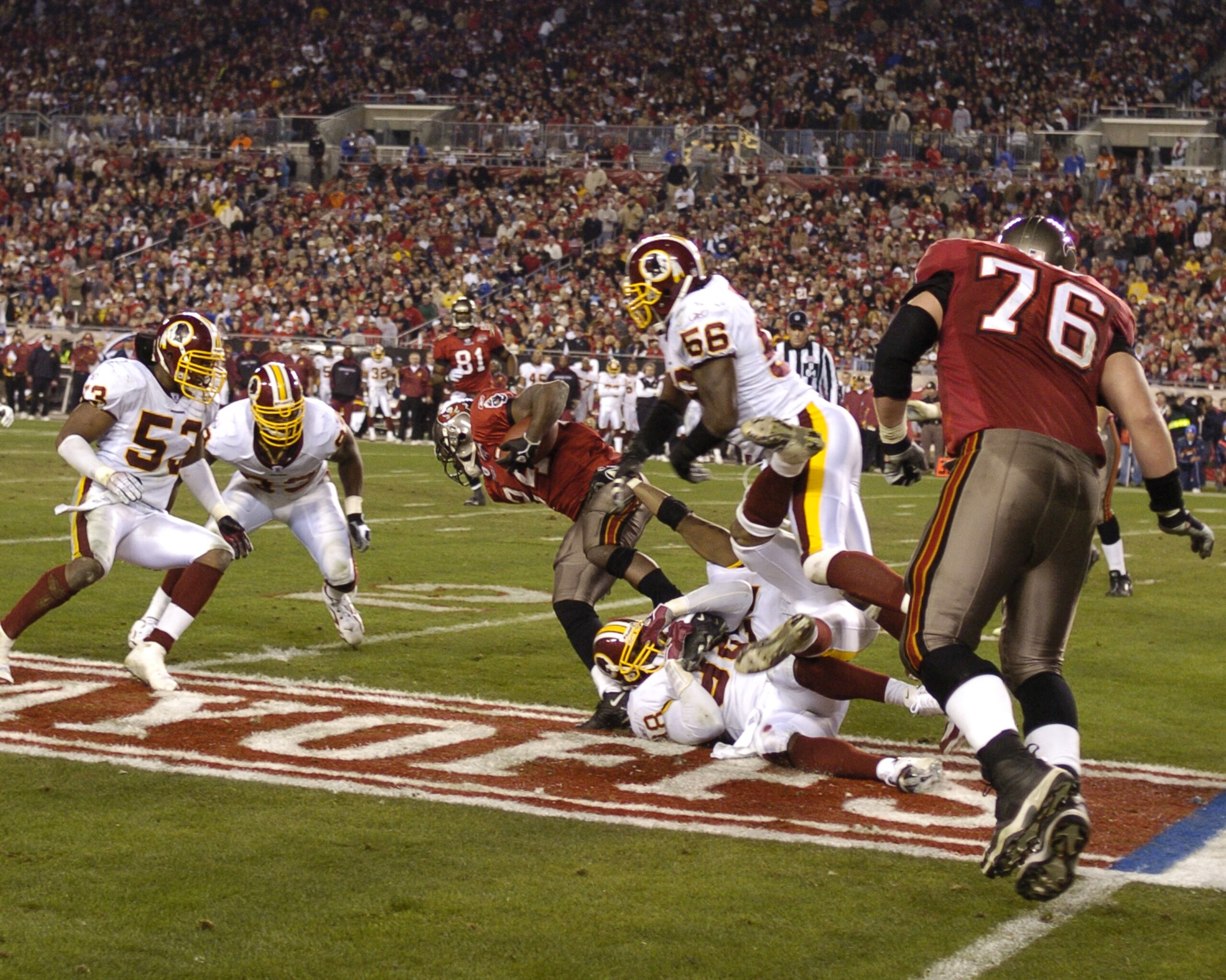 Tampa Bay Buccaneers running back Carnell Williams weaves upfield for a gain against the Washington Redskins in an NFL wild card playoff game January 7, 2006 in Tampa.  The Redskins defeated the Bucs 17 - 10.  (Photo by Al Messerschmidt/Getty Images)