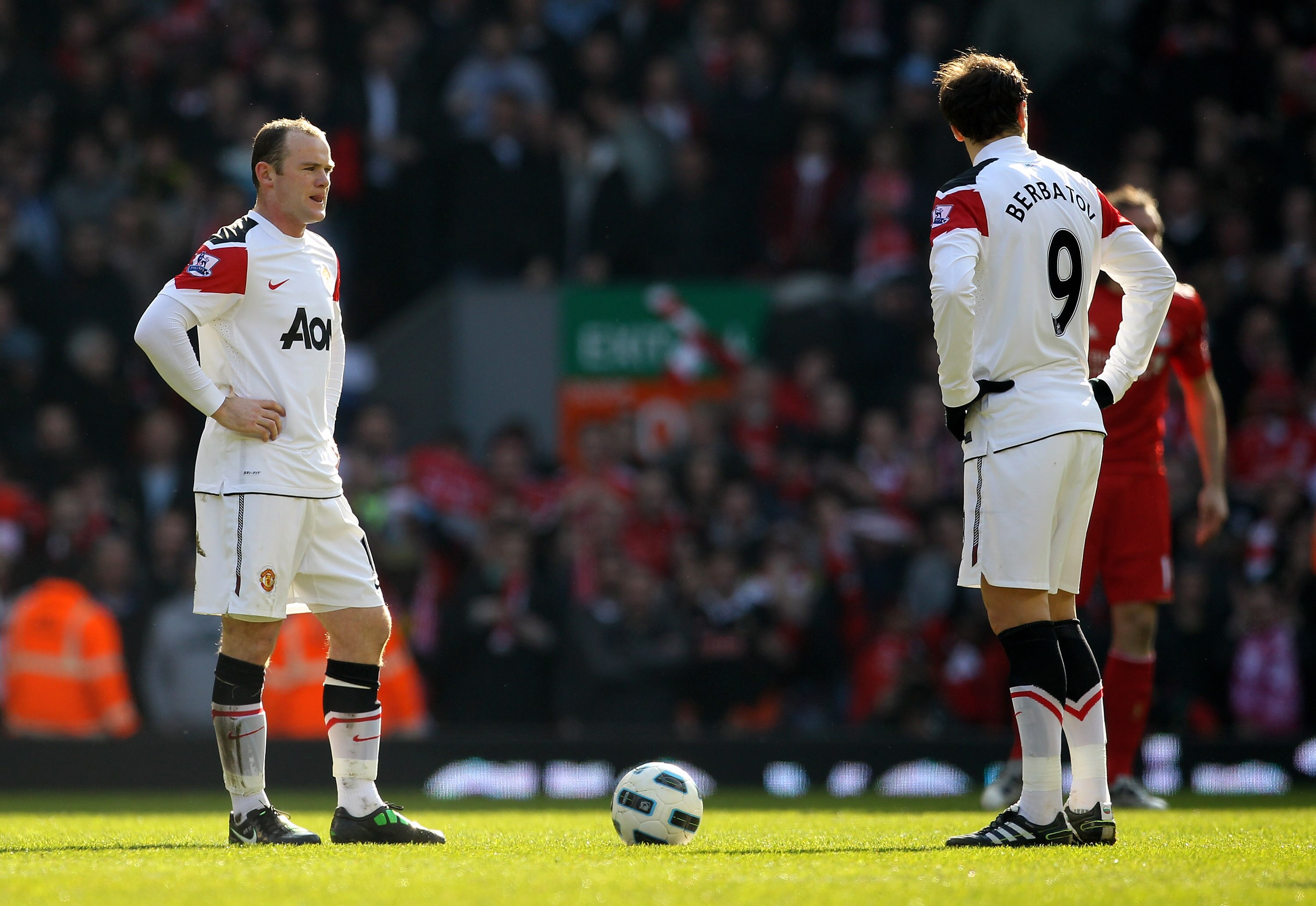 LIVERPOOL, ENGLAND - MARCH 06:  Dimitar Berbatov and Wayne Rooney of Manchester United prepare to kick off after conceding a goal during the Barclays Premier League match between Liverpool and Manchester United at Anfield on March 6, 2011 in Liverpool, En