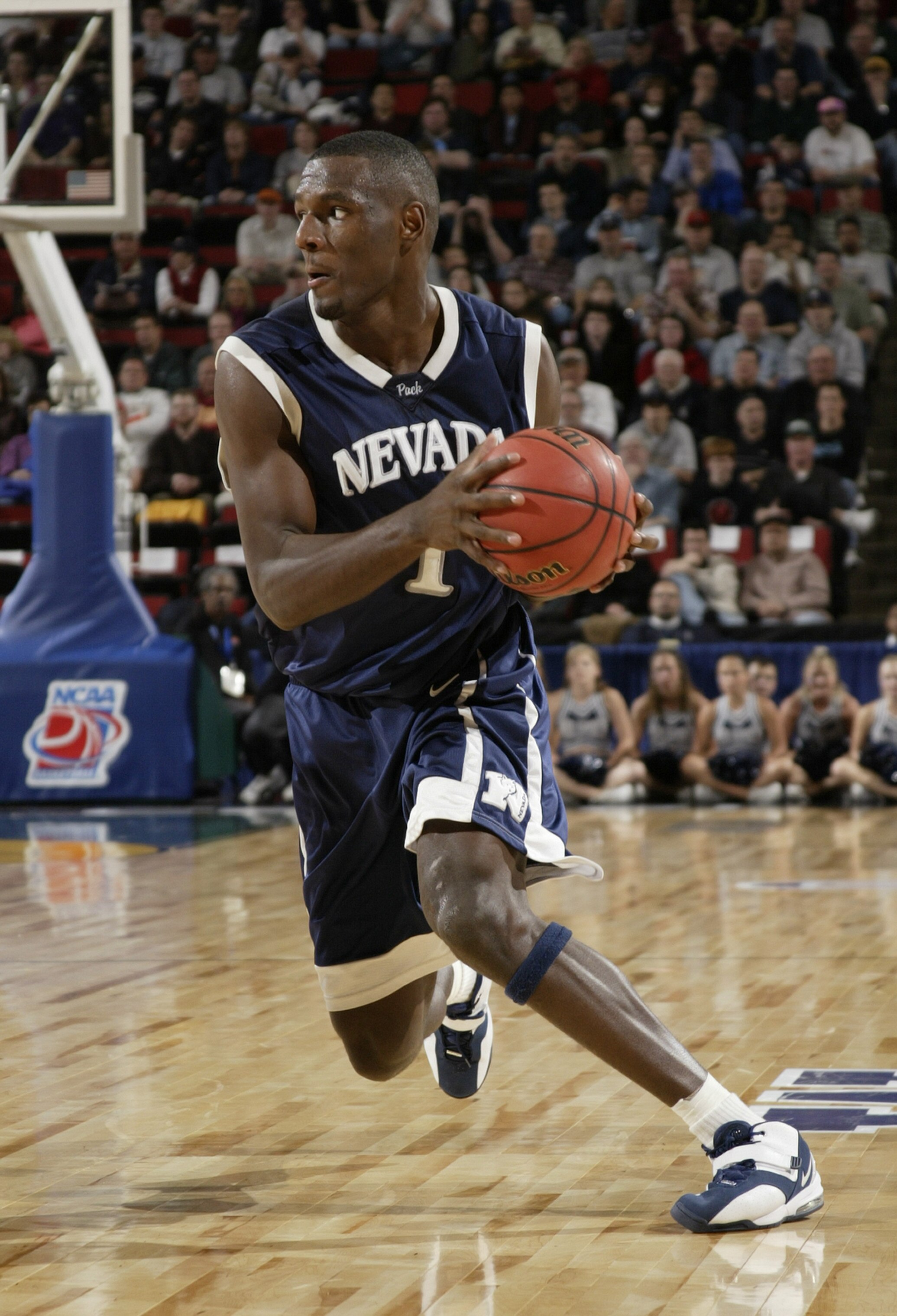 SEATTLE - MARCH 18:  Kirk Snyder #1 of the University of Nevada Wolf Pack drives against the Michigan State University Spartans during Game 3 of the 1st Round of the NCAA Division I Men's Basketball Tournament at Key Arena on March 18, 2004 in Seattle, Wa