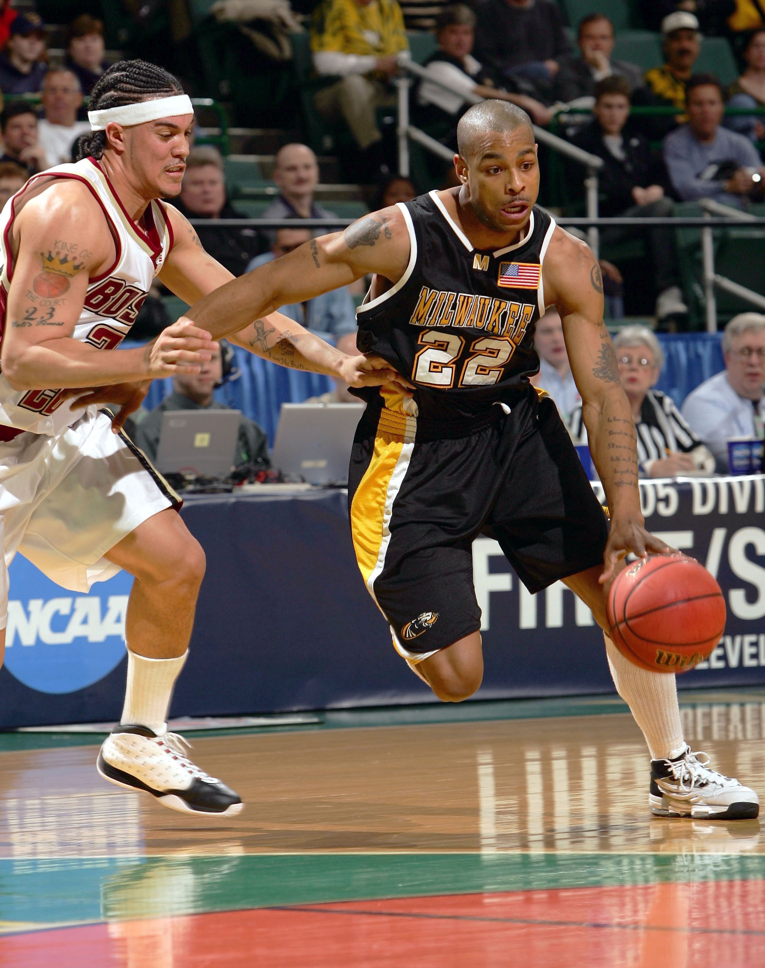 CLEVELAND - MARCH 19:  Ed McCants #22 of the Wisconsin-Milwaukee Panthers drives past Sean Marshall #23 of the Boston College Eagles during the second round of the 2005 NCAA Championship on March 19, 2005 at the Wolstein Center in Cleveland, Ohio.  (Photo
