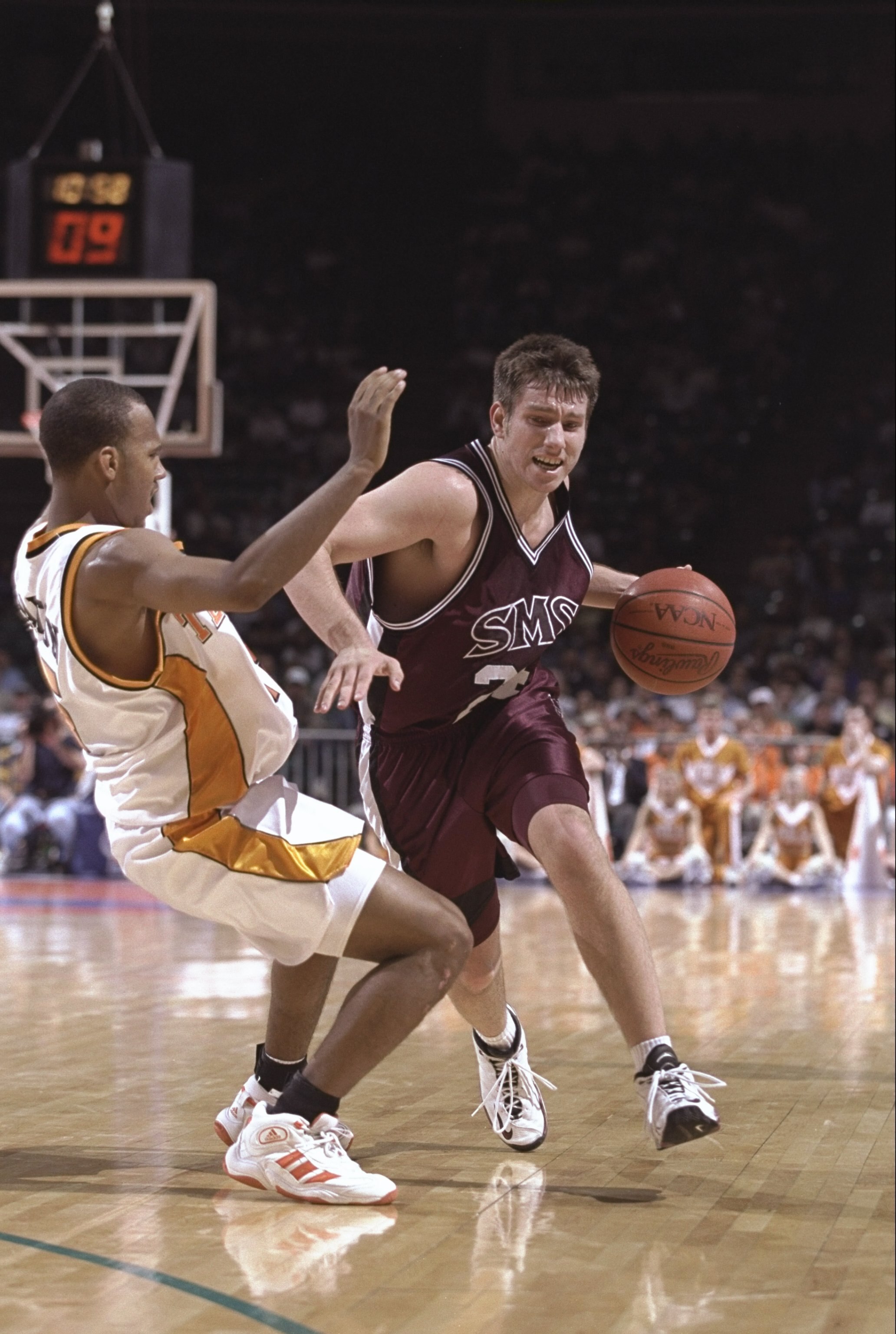 14 Mar 1999: Kevin Ault #24 of the SW Missouri State Bears dribbles the ball as he is blocked by Brandon Wharton #15 of the Tennessee Volunteers during the Second Round of the NCAA Championships game  at the Charlotte Coliseum in Charlotte, North Carolina