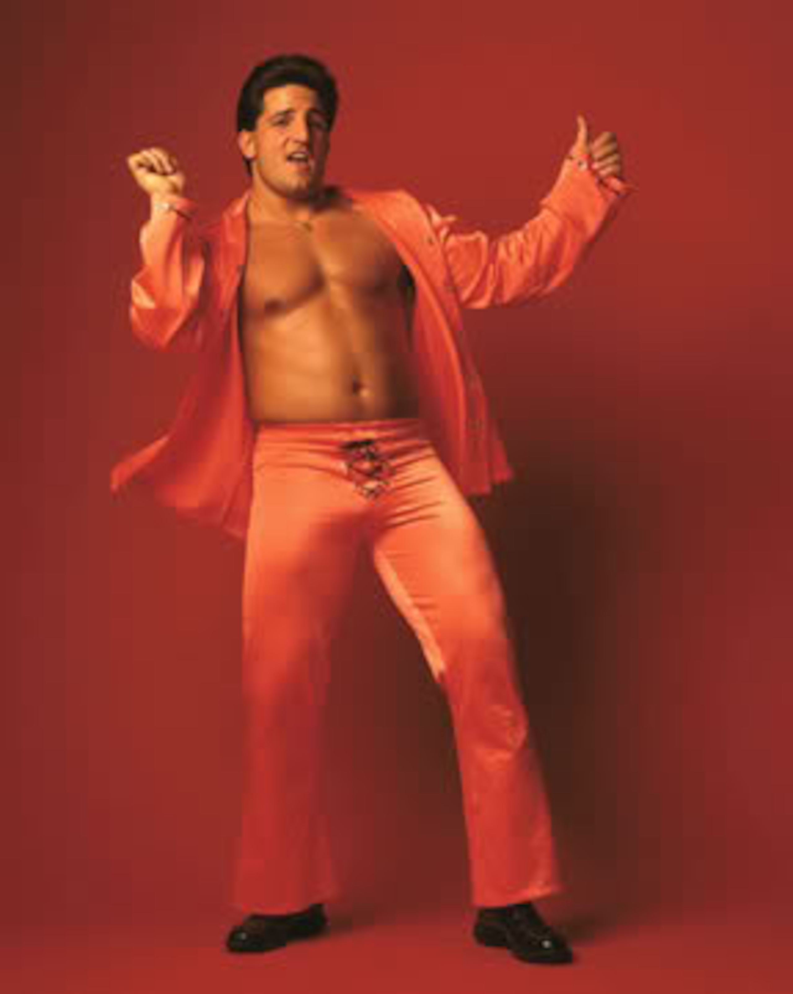 He looks like the flamboyant younger brother of Tony Manero from Saturday Night Fever. He looks like the flamboyant younger brother of Tony Manero from Saturday Night Fever.