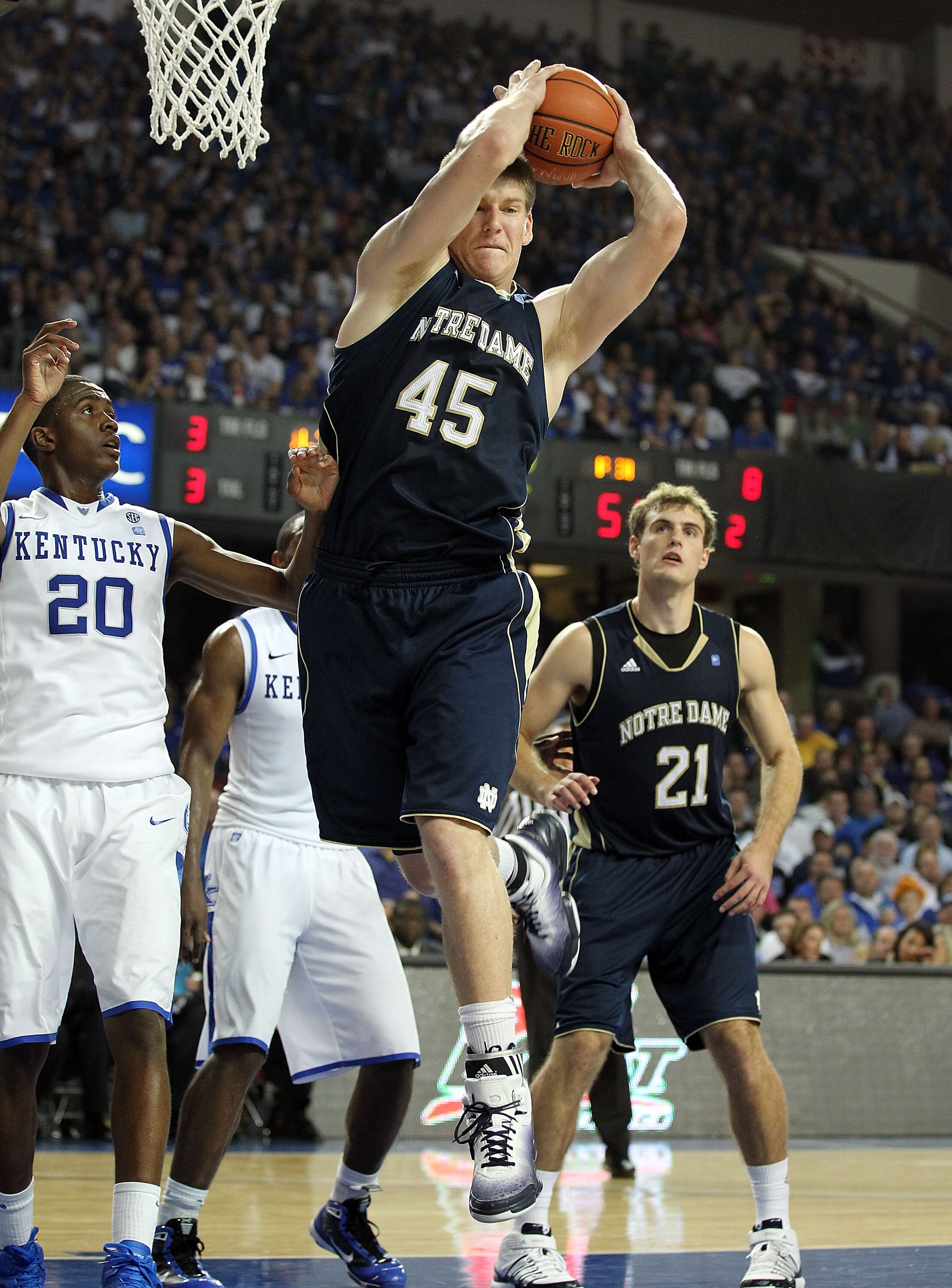LOUISVILLE, KY - DECEMBER 08:  Jack Cooley #45 of the Notre Dame Fighting Irish grabs a rebound during the game against the Kentucky Wildcats in the 2010 DIRECTV SEC/BIG EAST Invitational at Freedom Hall on December 8, 2010 in Louisville, Kentucky.  (Phot