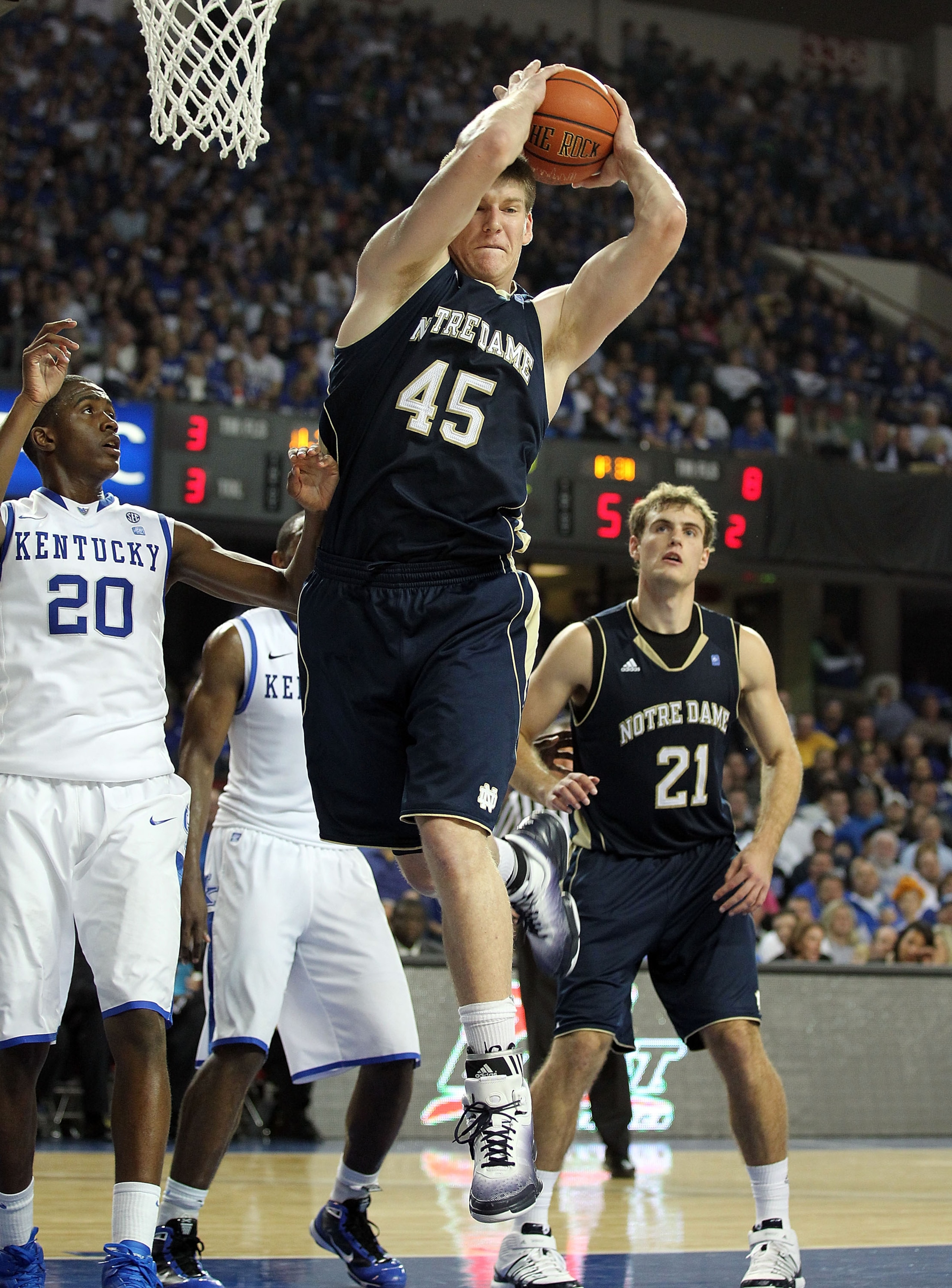 LOUISVILLE, KY - DECEMBER 08:  Jack Cooley #45 of the Notre Dame Fighting Irish grabs a rebound during the game against the Kentucky Wildcats in the 2010 DIRECTV SEC/BIG EAST Invitational at Freedom Hall on December 8, 2010 in Louisville, Kentucky.  (Phot