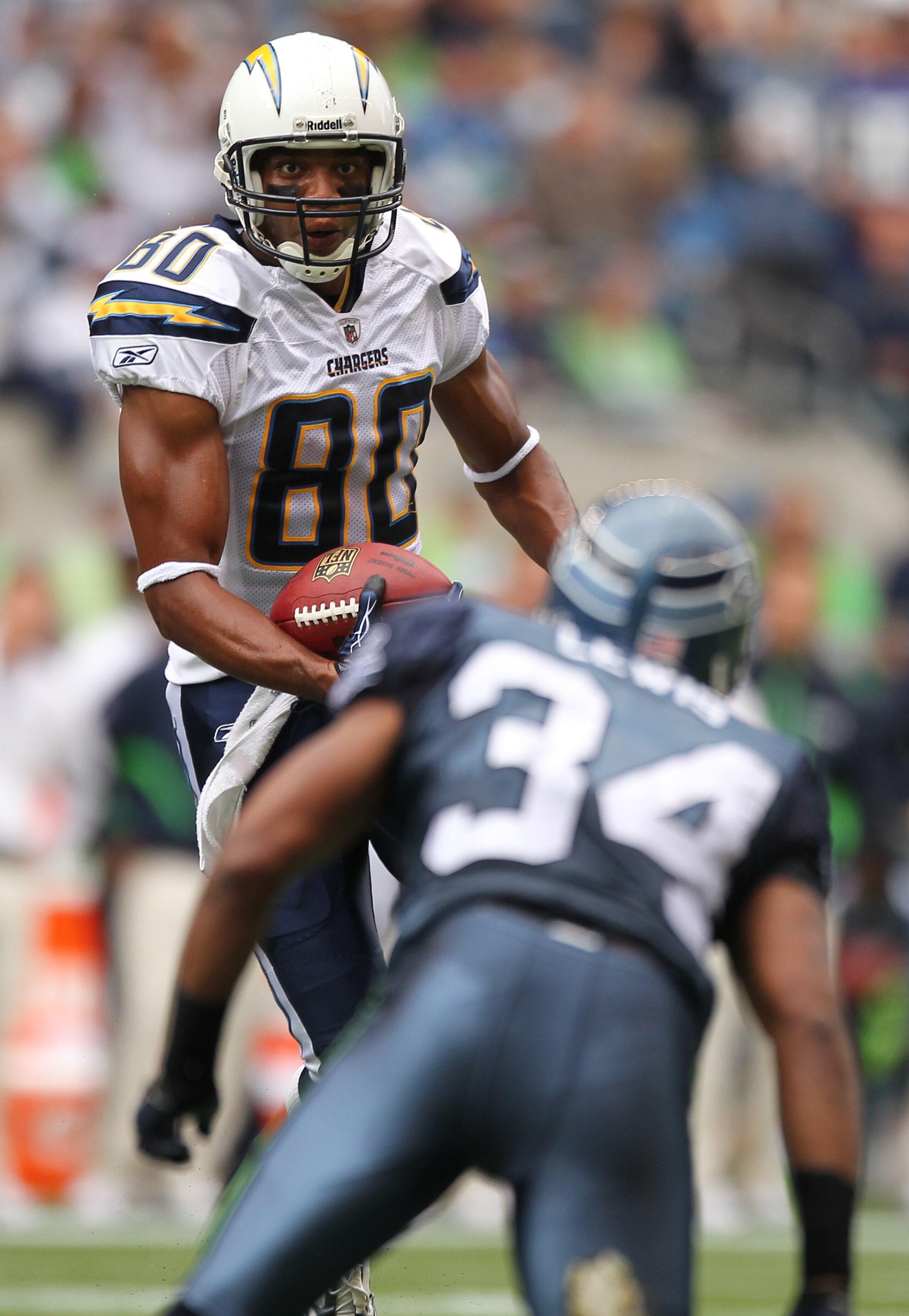 SEATTLE - SEPTEMBER 26:  Wide receiver Malcom Floyd #80 of the San Diego Chargers rushes against Roy Lewis #34 of the Seattle Seahawks at Qwest Field on September 26, 2010 in Seattle, Washington. (Photo by Otto Greule Jr/Getty Images)