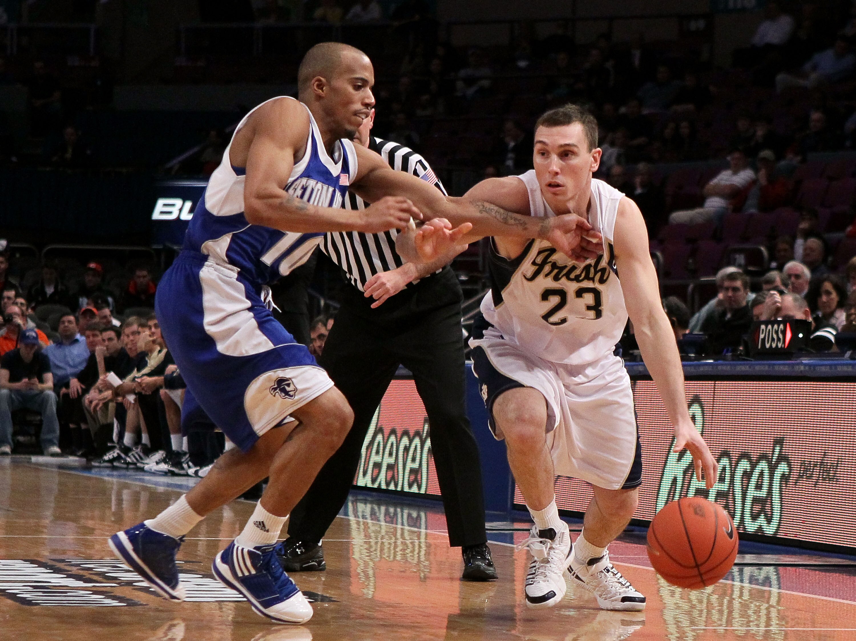 NEW YORK - MARCH 10: Ben Hansbrough #23 of the Notre Dame Fighting Irish handles the ball against Jordan Theodore #10 of the Seton Hall Pirates during the second round of 2010 NCAA Big East Tournament at Madison Square Garden on March 10, 2010 in New York