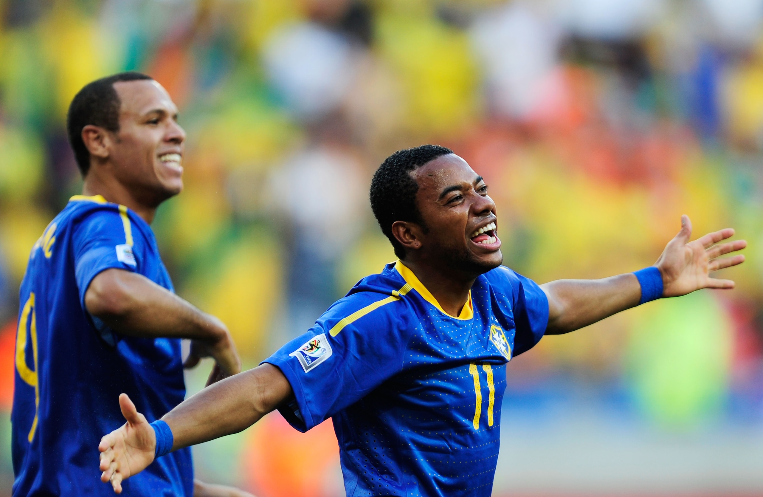 PORT ELIZABETH, SOUTH AFRICA - JULY 02:  Luis Fabiano (L) celebrates with Robinho of Brazil after he scored the opening goal during the 2010 FIFA World Cup South Africa Quarter Final match between Netherlands and Brazil at Nelson Mandela Bay Stadium on Ju