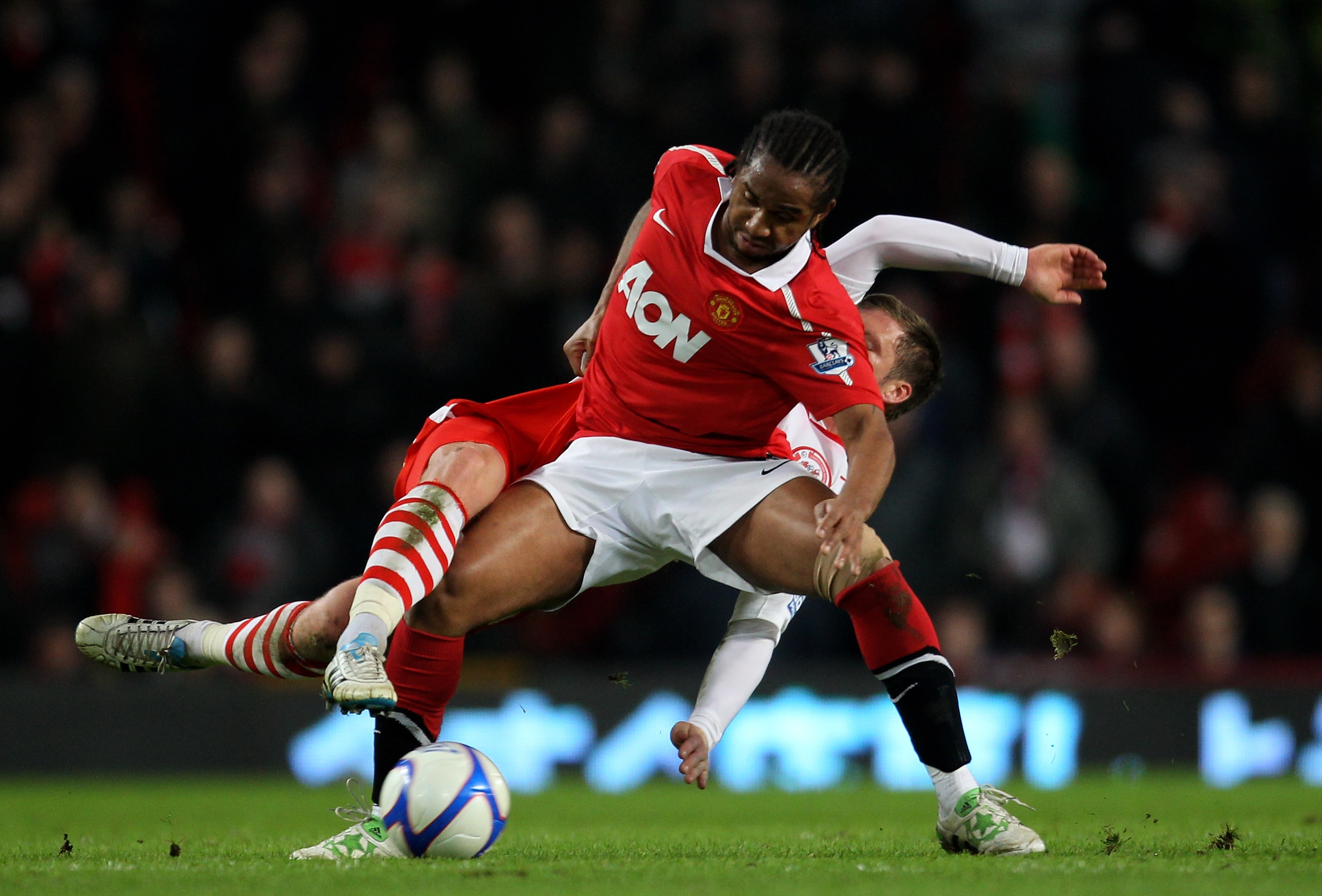 MANCHESTER, ENGLAND - FEBRUARY 19:  Oliveira Anderson of Manchester United is challenged by Dannie Bullman of Crawley Town during the FA Cup sponsored by E.ON 5th round match between Manchester United and Crawley Town at Old Trafford on February 19, 2011