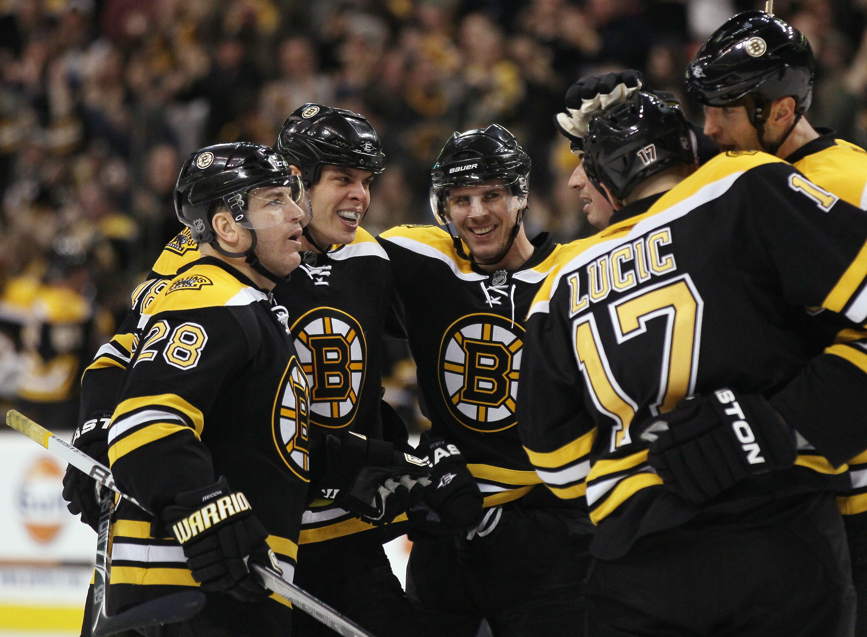 BOSTON, MA - MARCH 05:  David Krejci #46 of the Boston Bruins is congratulated by teammates Mark Recchi #28,Nathan Horton #18,Milan Lucic #17 and Zdeno Chara #33 after Krejci scored a goal in the final minute of the game to send it into overtime against t