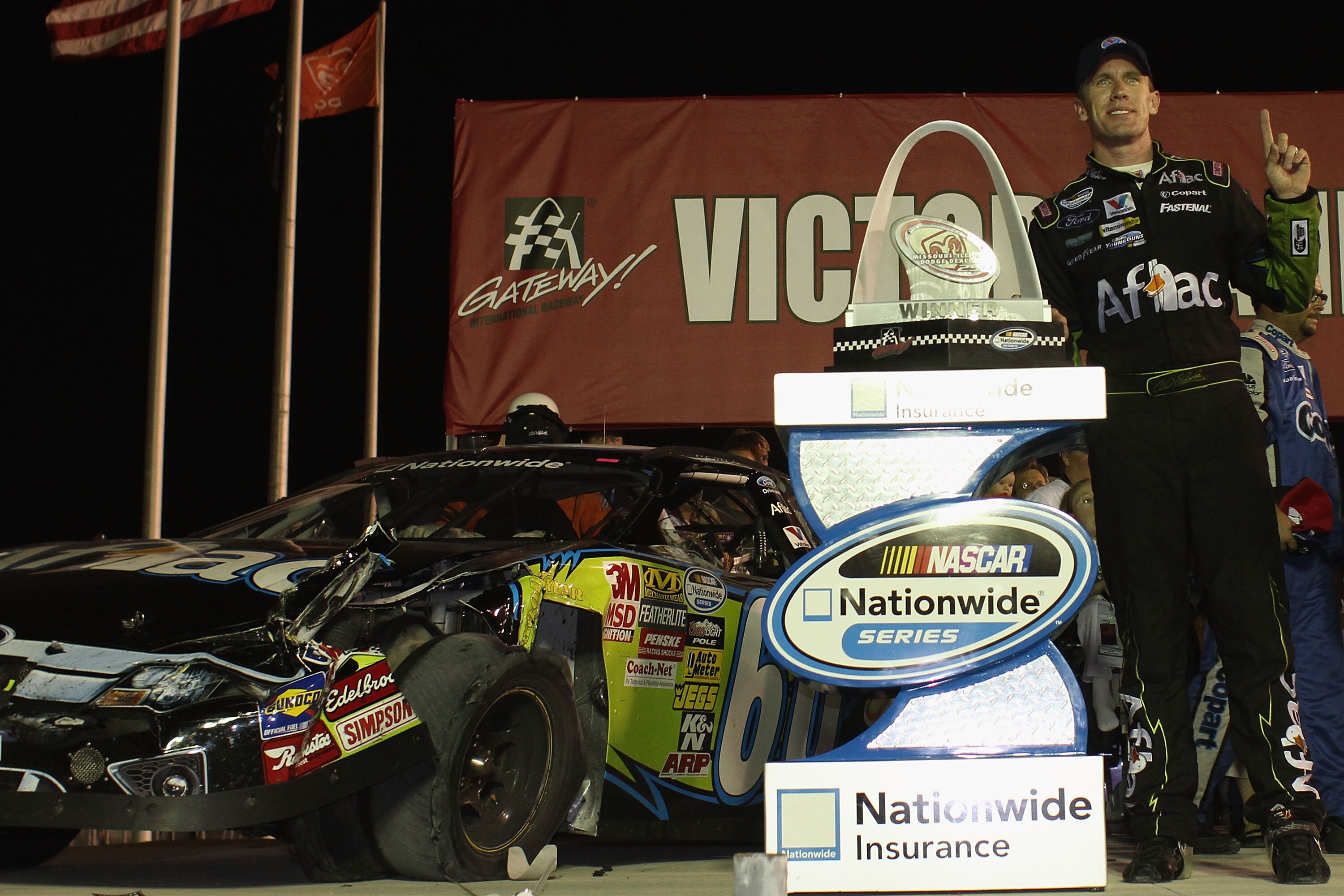 MADISON, IL - JULY 17: Carl Edwards driver of the #60 Aflac Ford poses with the trophy after winning the NASCAR Nationwide Series Missouri-Illinois Dodge Dealers 250 at Gateway International Raceway on July 17, 2010 in Madison, Illinois.  (Photo by Dilip