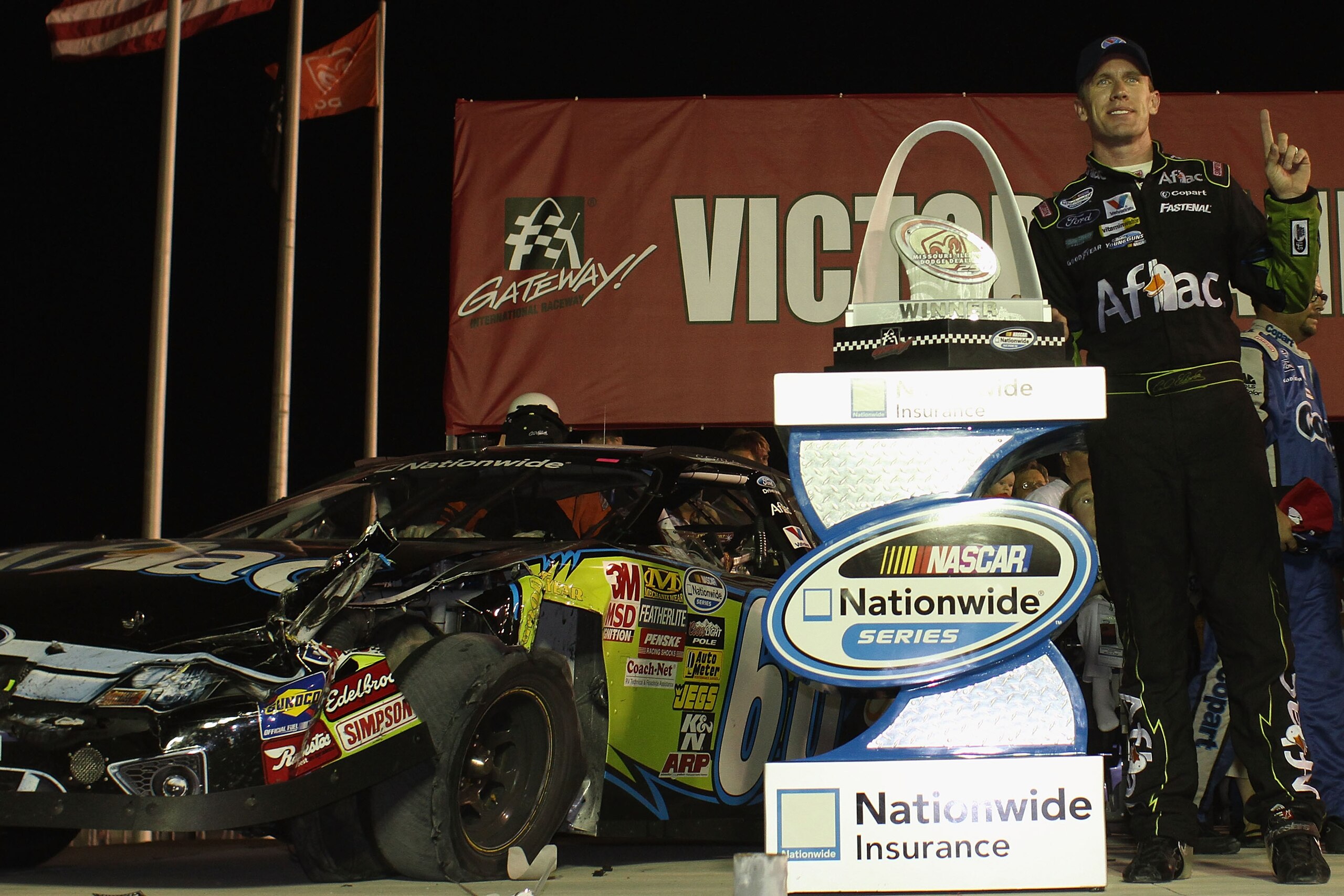 MADISON, IL - JULY 17: Carl Edwards driver of the #60 Aflac Ford poses with the trophy after winning the NASCAR Nationwide Series Missouri-Illinois Dodge Dealers 250 at Gateway International Raceway on July 17, 2010 in Madison, Illinois.  (Photo by Dilip
