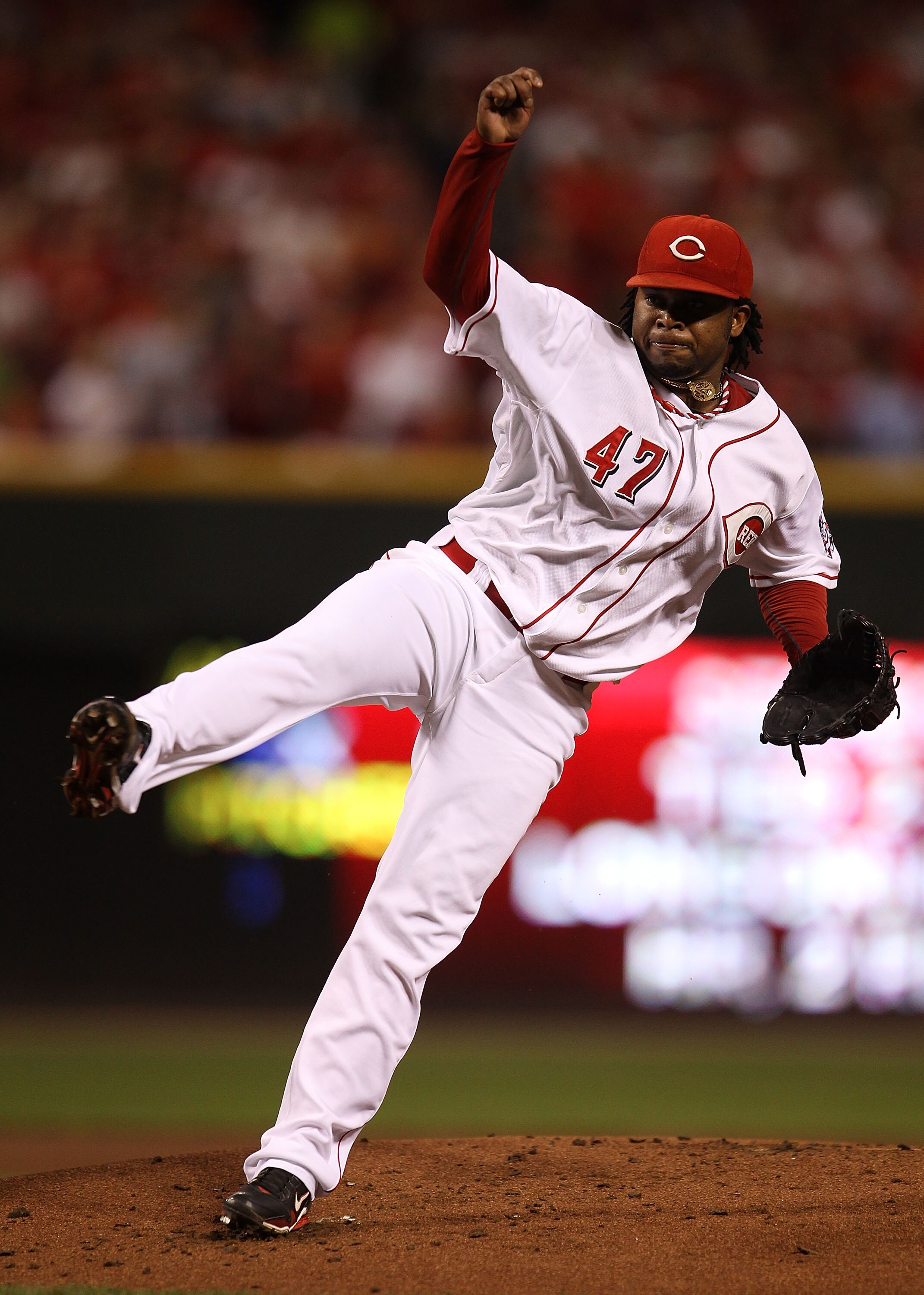 CINCINNATI - OCTOBER 10: Starting pitcher Johnny Cueto #47 of the Cincinnati Reds follows through after delivering the ball against the Philadelphia Phillies during game 3 of the NLDS at Great American Ball Park on October 10, 2010 in Cincinnati, Ohio.  T