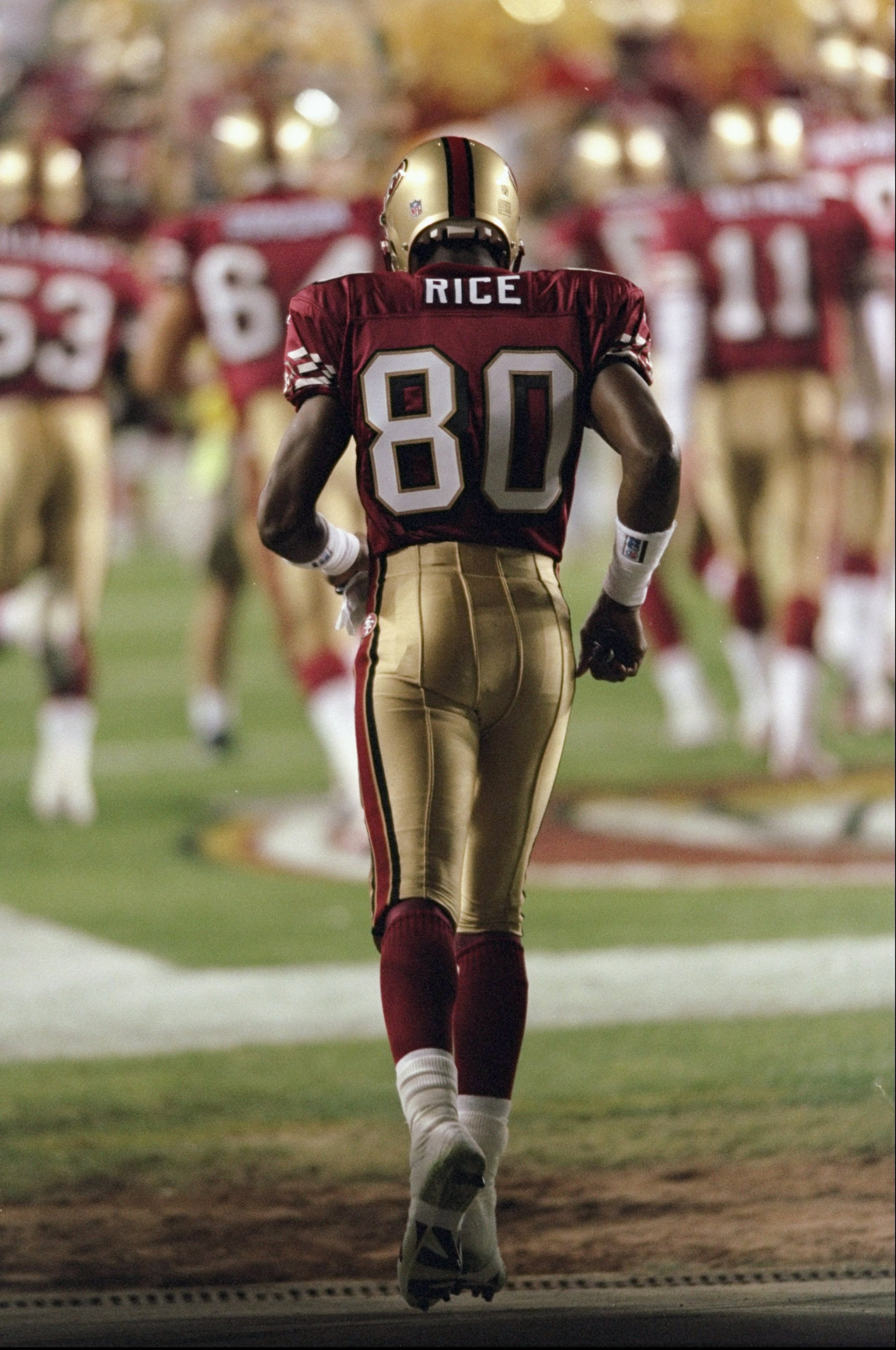 14 Sep 1998:  Jerry Rice #80 of the San Francisco 49ers runs out of the tunnel and on to the field prior to a game against the Washington Redskins at the Jack Kent Cooke Stadium in Landover, Maryland. The 49ers defeated the Redskins 45-10. Mandatory Credi
