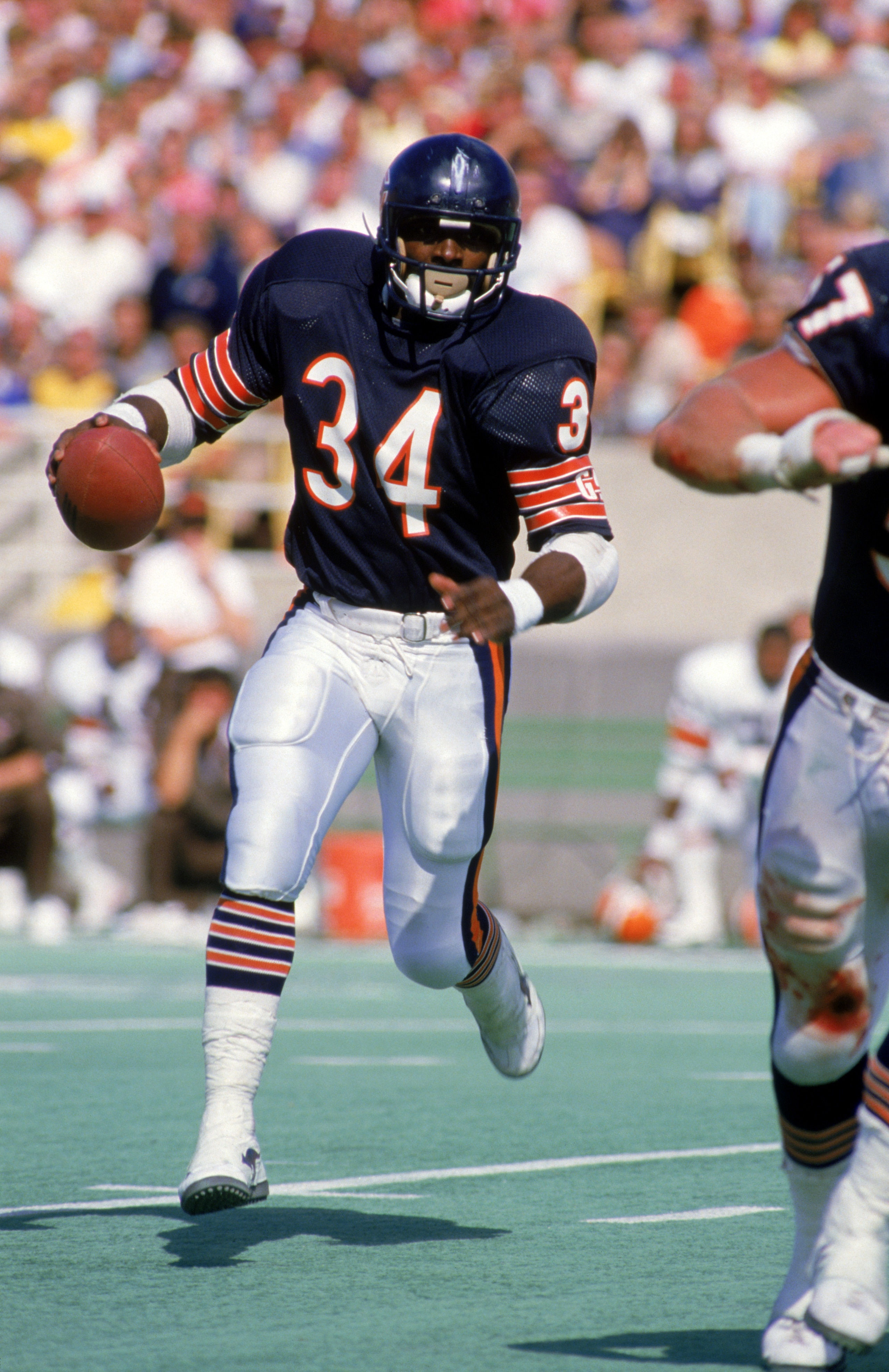 CHICAGO - UNDATED:  Running back Walter Payton #34 of the Chicago Bears rushes for yards during a game circa 1975-1987 at Soldier Field in Chicago, Illinois.  (Photo by Jonathan Daniel/Getty Images)