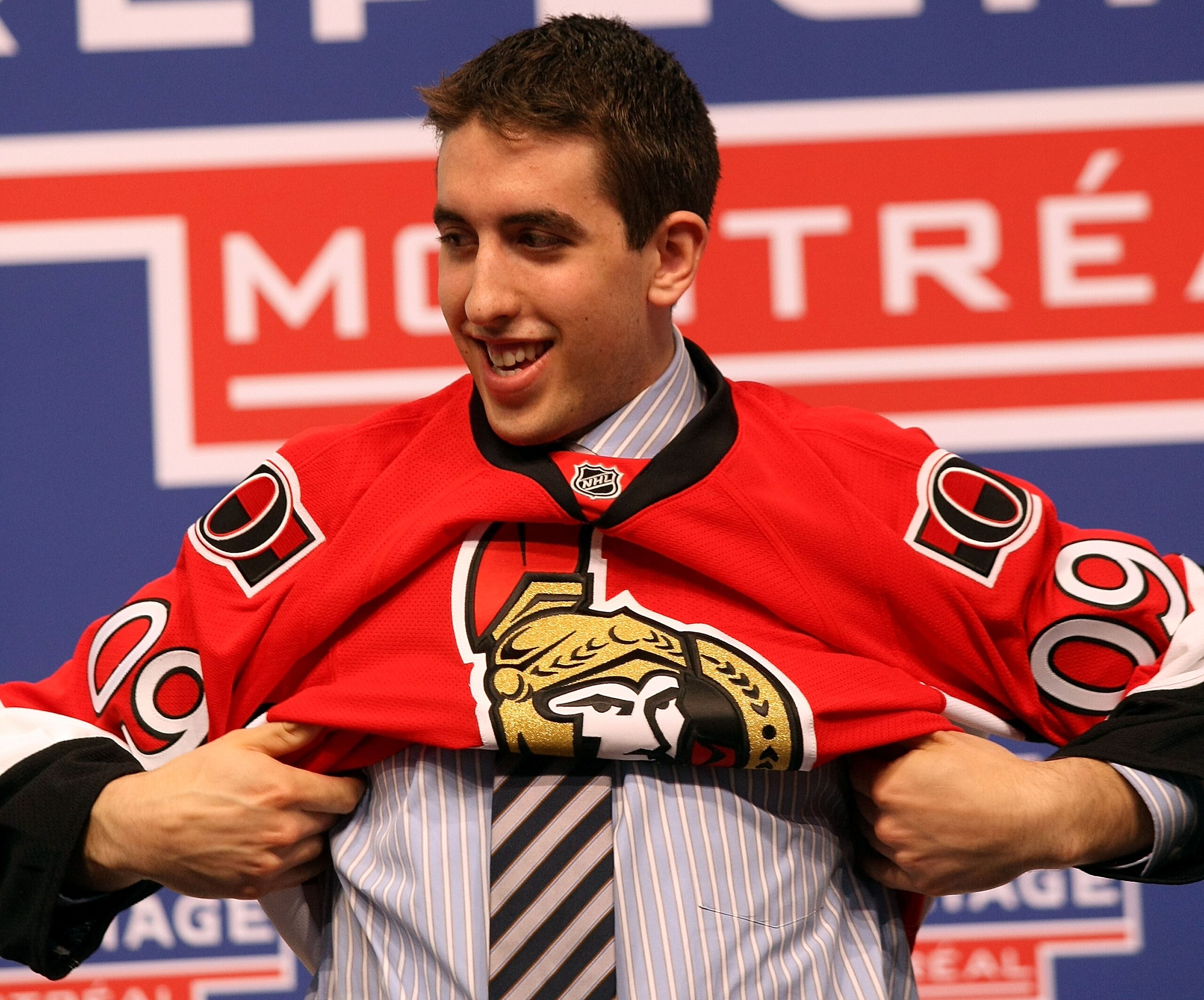 MONTREAL, QC - JUNE 26:  Jared Cowen puts on his new Ottawa Senators sweater after he was selected #9 overall by the Senators during the first round of the 2009 NHL Entry Draft at the Bell Centre on June 26, 2009 in Montreal, Quebec, Canada.  (Photo by Br