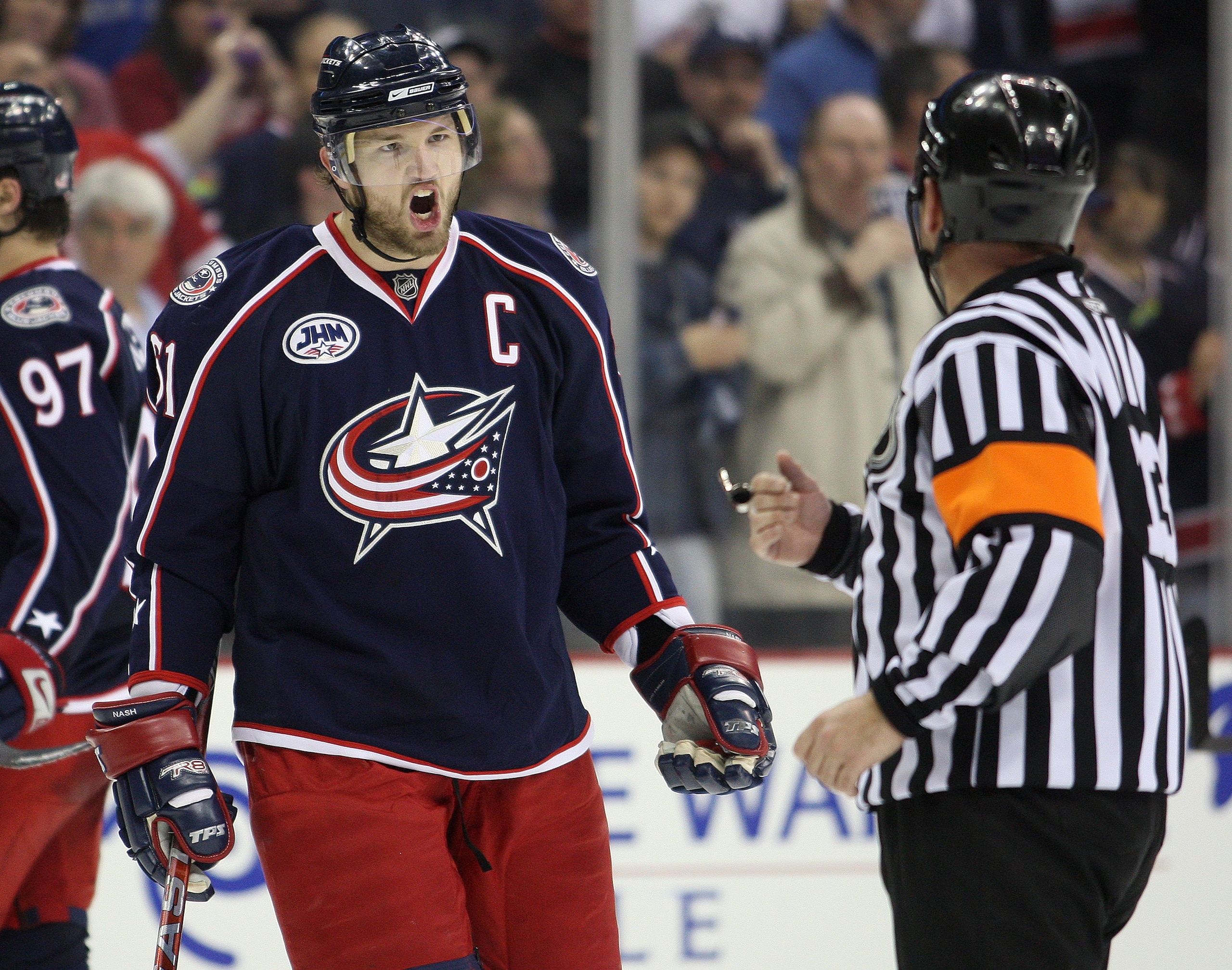 COLUMBUS, OHIO - APRIL 23:  Rick Nash #61 of the Columbus Blue Jackets questions referee Dan O'Halloran #13 about a late game call against the Detroit Red Wings during Game Four of the Western Conference Quarterfinals of the 2009 Stanley Cup Playoffs on A