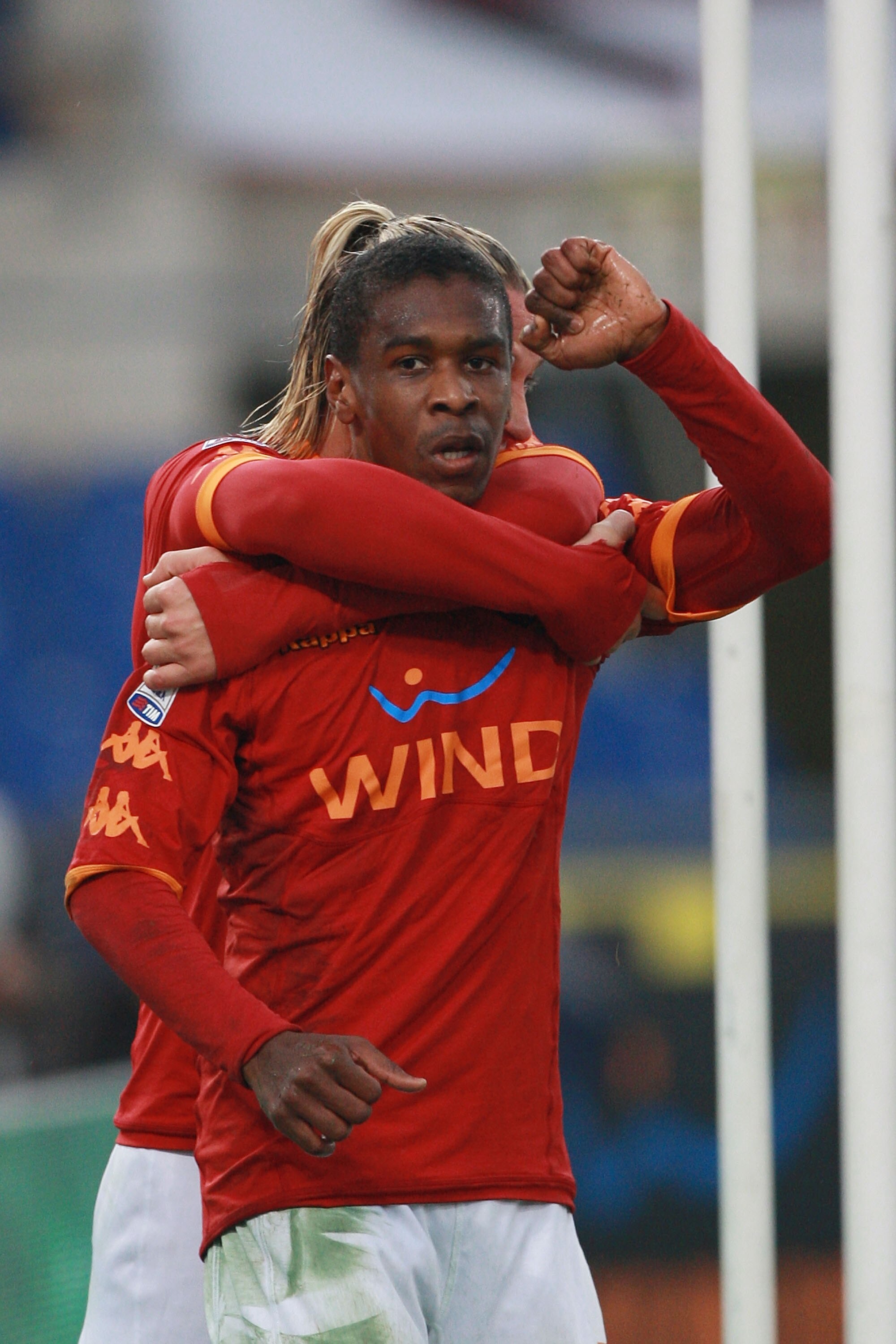 ROME, ITALY - DECEMBER 12:  Juan (R) with his teammate Philippe Mexes of AS Roma celebrates after scoring the opening goal during the Serie A match between AS Roma and AS Bari at Stadio Olimpico on December 12, 2010 in Rome, Italy.  (Photo by Paolo Bruno/