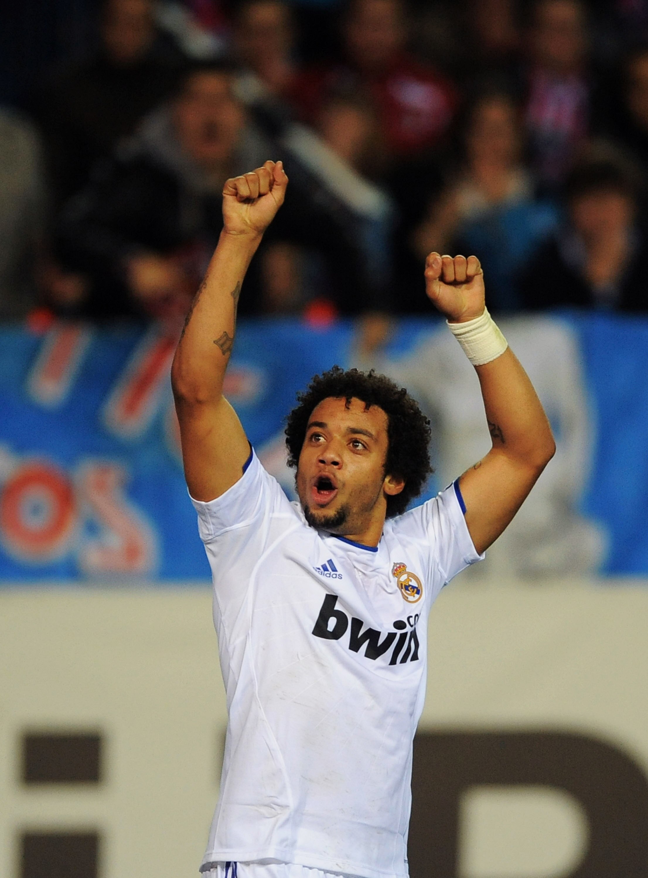MADRID, SPAIN - JANUARY 20:  Marcelo of Real Madrid celebrates after Real  scored their first goal during the Copa del Rey quarter final second leg match between Atletico Madrid and Real Madrid at Vicente Calderon Stadium on January 20, 2011 in Madrid, Sp