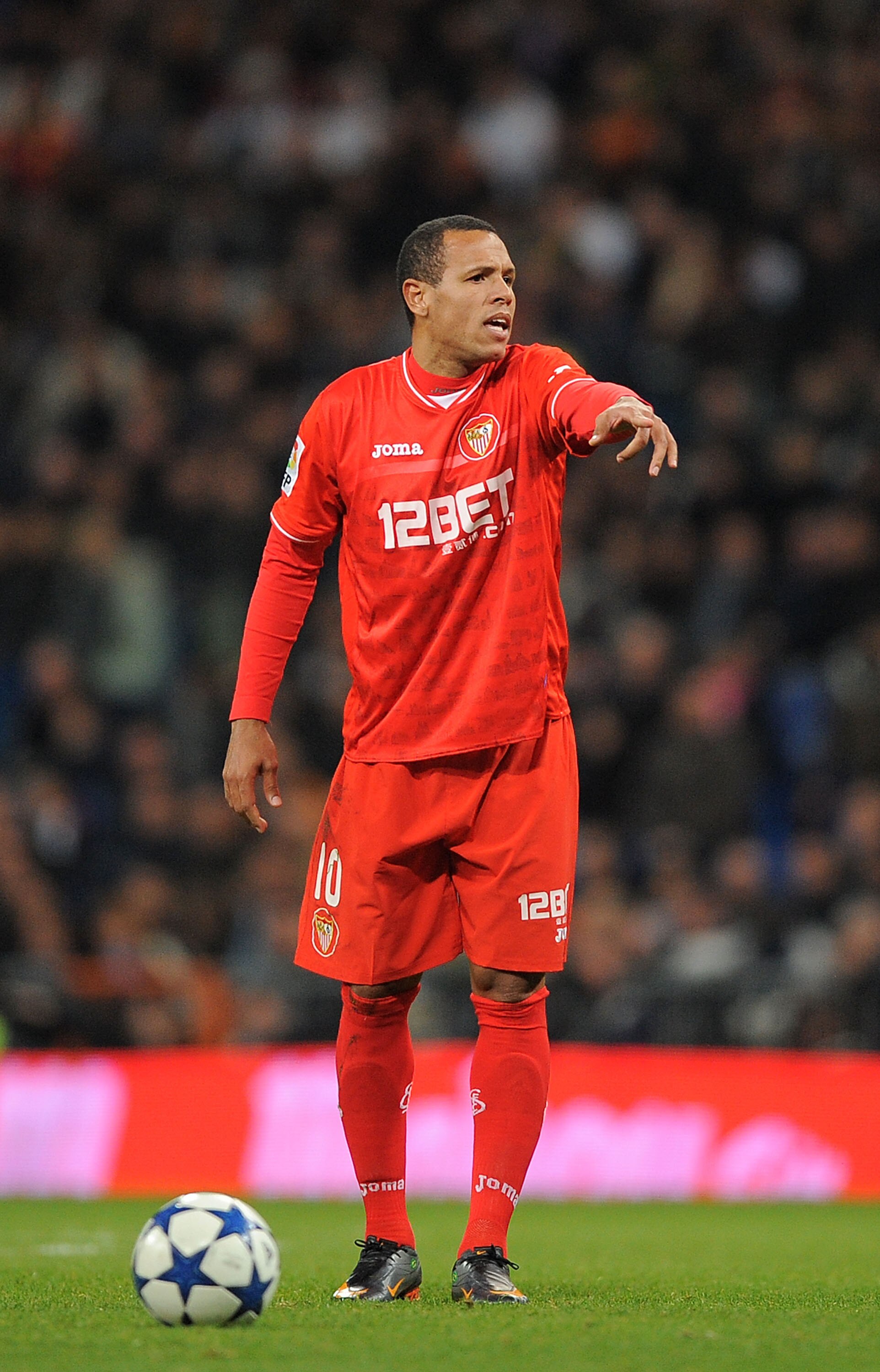 MADRID, SPAIN - FEBRUARY 02: Luis Fabiano Sevilla gets ready to take a free kick during the Copa del Rey semi-final second leg match between Real Madrid and Sevilla at Estadio Santiago Bernabeu on February 2, 2011 in Madrid, Spain.  (Photo by Denis Doyle/
