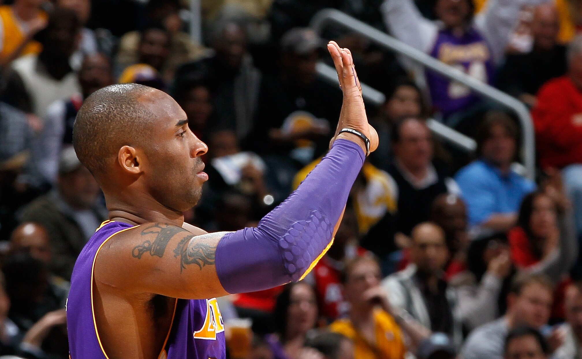 ATLANTA, GA - MARCH 08:  Kobe Bryant #24 of the Los Angeles Lakers walks onto the court against the Atlanta Hawks at Philips Arena on March 8, 2011 in Atlanta, Georgia.  NOTE TO USER: User expressly acknowledges and agrees that, by downloading and/or usin