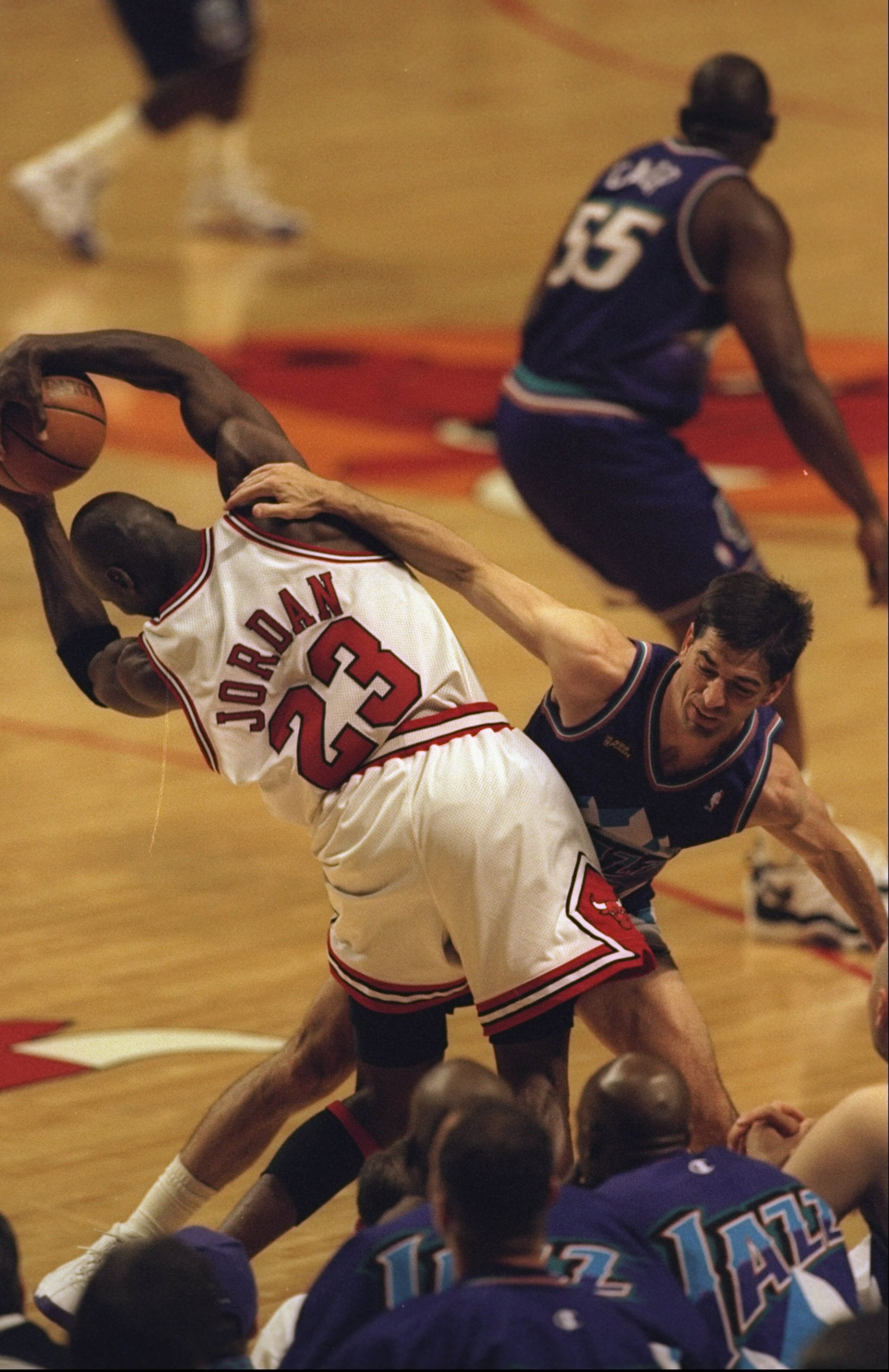 7 Jun 1998:  Michael Jordan #23 of the Chicago Bulls Keeps the ball away from John Stockton #12 of the Utah Jazz during the NBA Finals game 3 at the United Center in Chicago, Illinois.  The Bulls defeated the Jazz 96-54. Mandatory Credit: Jonathan Daniel