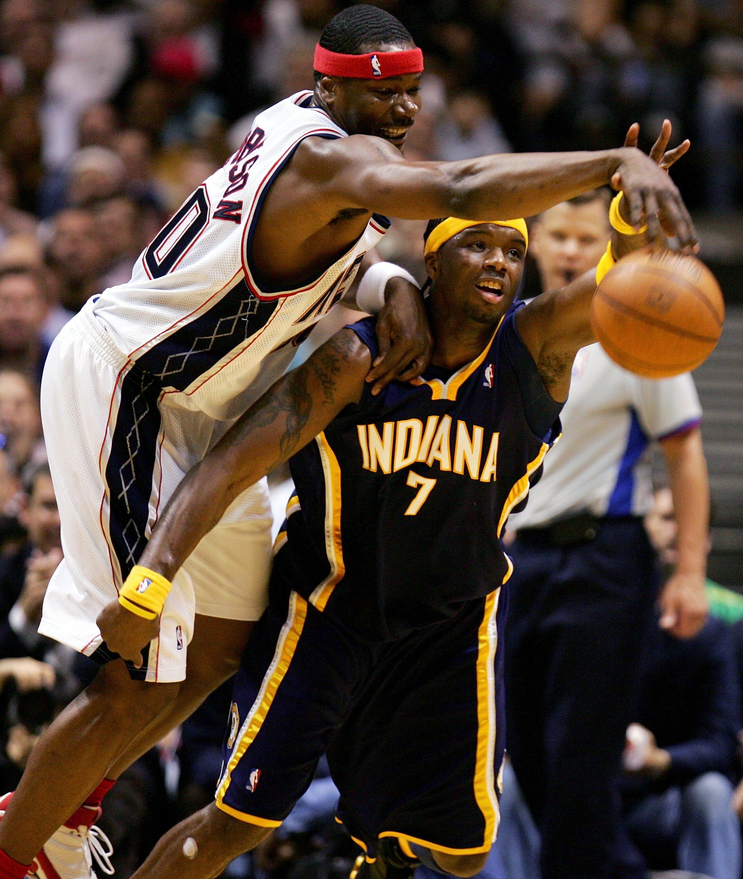 EAST RUTHERFORD, NJ - APRIL 25:  Clifford Robinson #10 of the New Jersey Nets (L) committs an offensive foul by climbing over the back of Jermaine O'Neal #7 of the Indiana Pacers in game two of the Eastern Conference Quarterfinals during the 2006 NBA Play